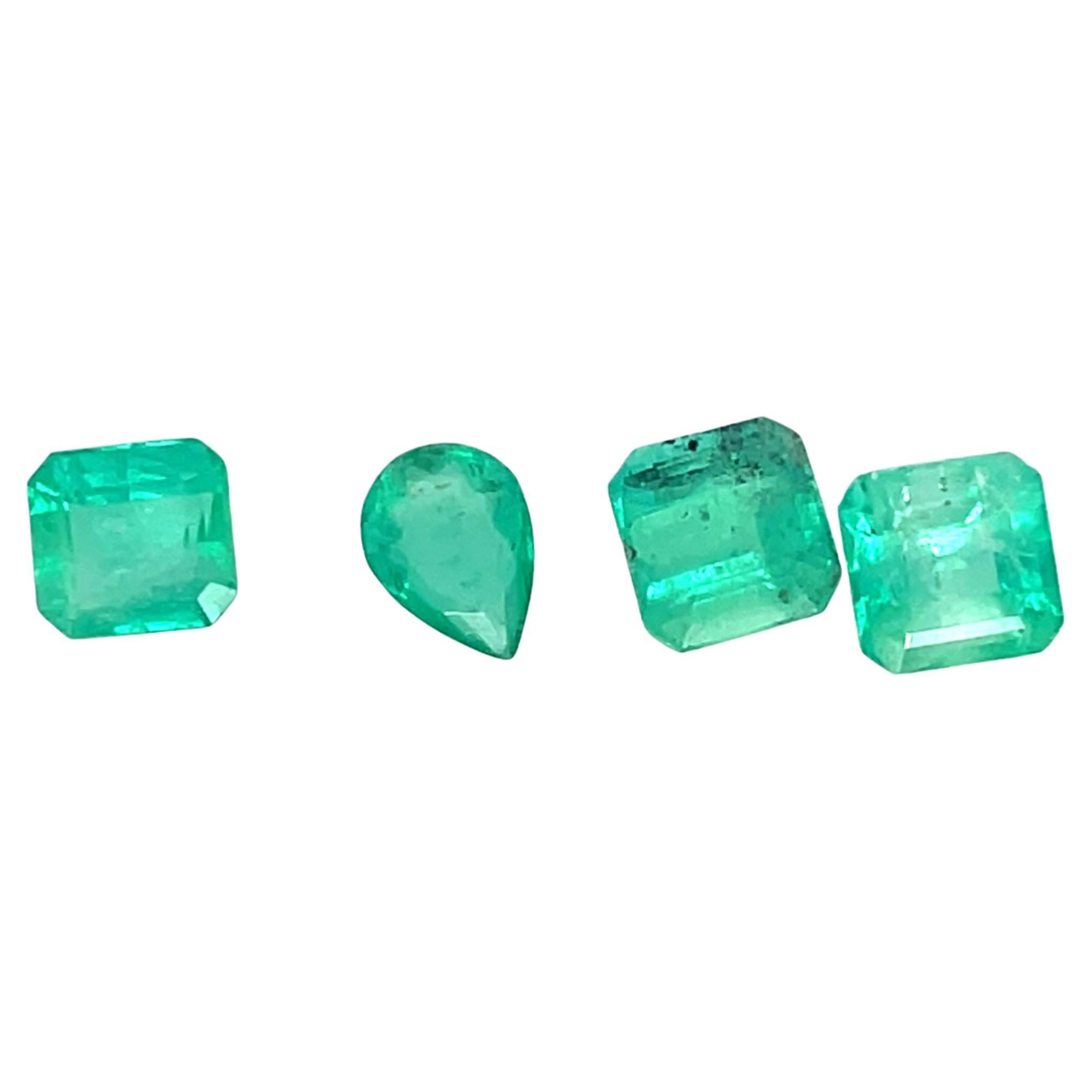 A captivating set of four natural emeralds, featuring three classic emerald-cut stones and one elegant pear-cut gem, totaling 7.14 carats. 

Sourced from Colombia, these emeralds display a lush green hue, symbolizing renewal, wisdom, and