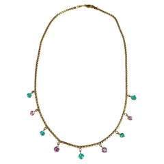 Collier d
émeraudes et de spinelles roses en or 14k