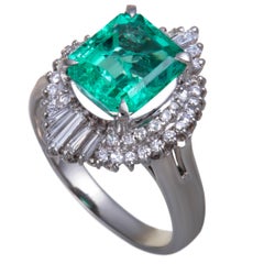 Emerald and Round and Tapered Baguette Diamond Platinum Ring