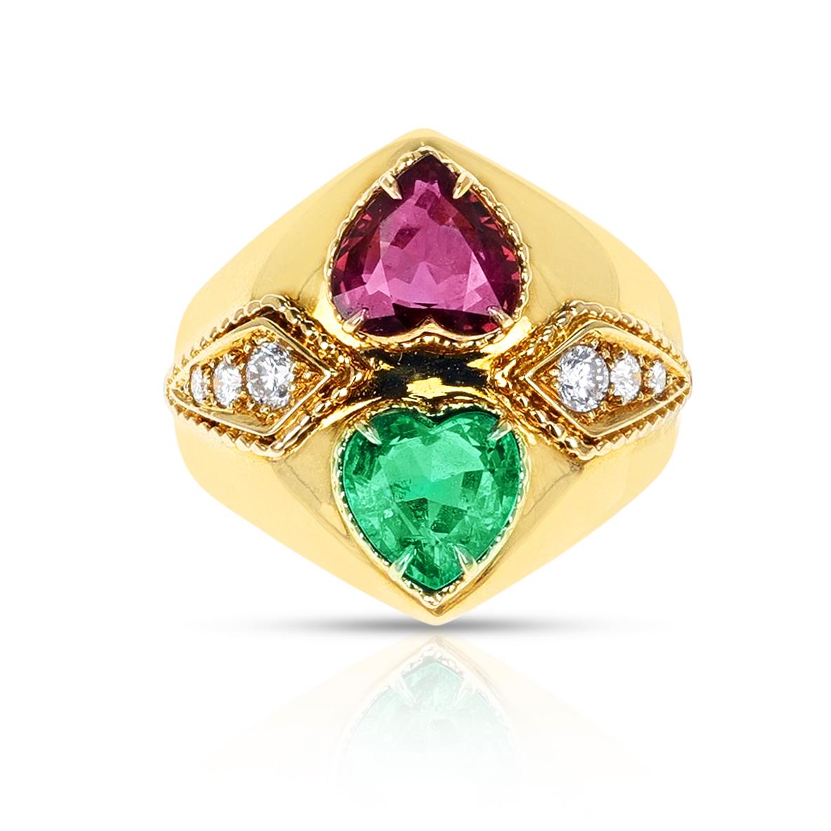 A Emerald and Ruby Heart Ring with Diamonds made in 18 Karat Yellow Gold. The weights are appx: Emerald 1.09 carats, Ruby 1.21 cts, Diamond 0.25 cts. The ring size is 6.75 US. The total weight is 9.60 grams. 