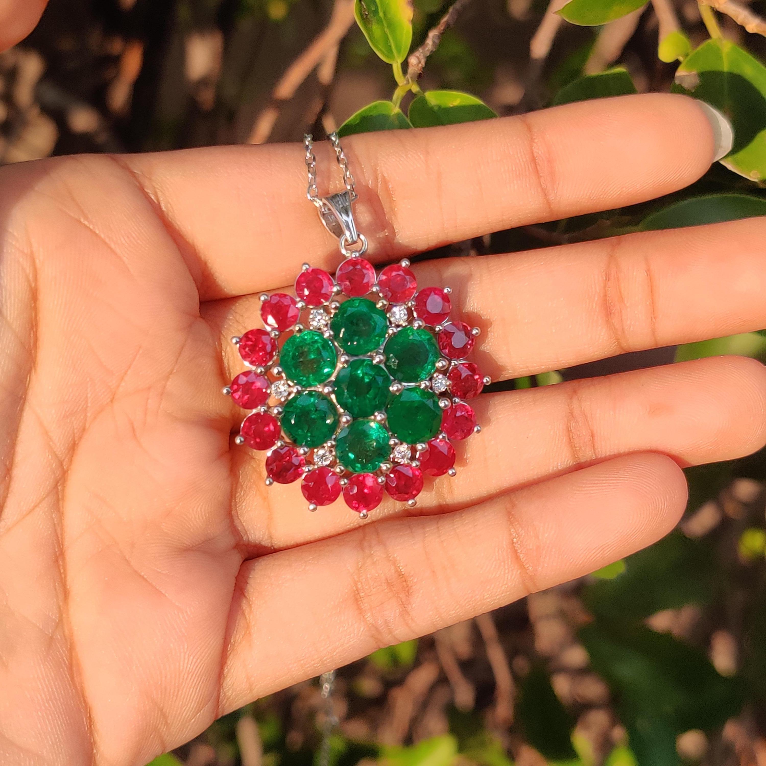 Introducing an extraordinary and enchanting pendant that captures attention with its bold and elegant flower-like design—meet the Emerald and Ruby Pendant! Crafted with utmost care, this exquisite piece is tailored for those who wish to express