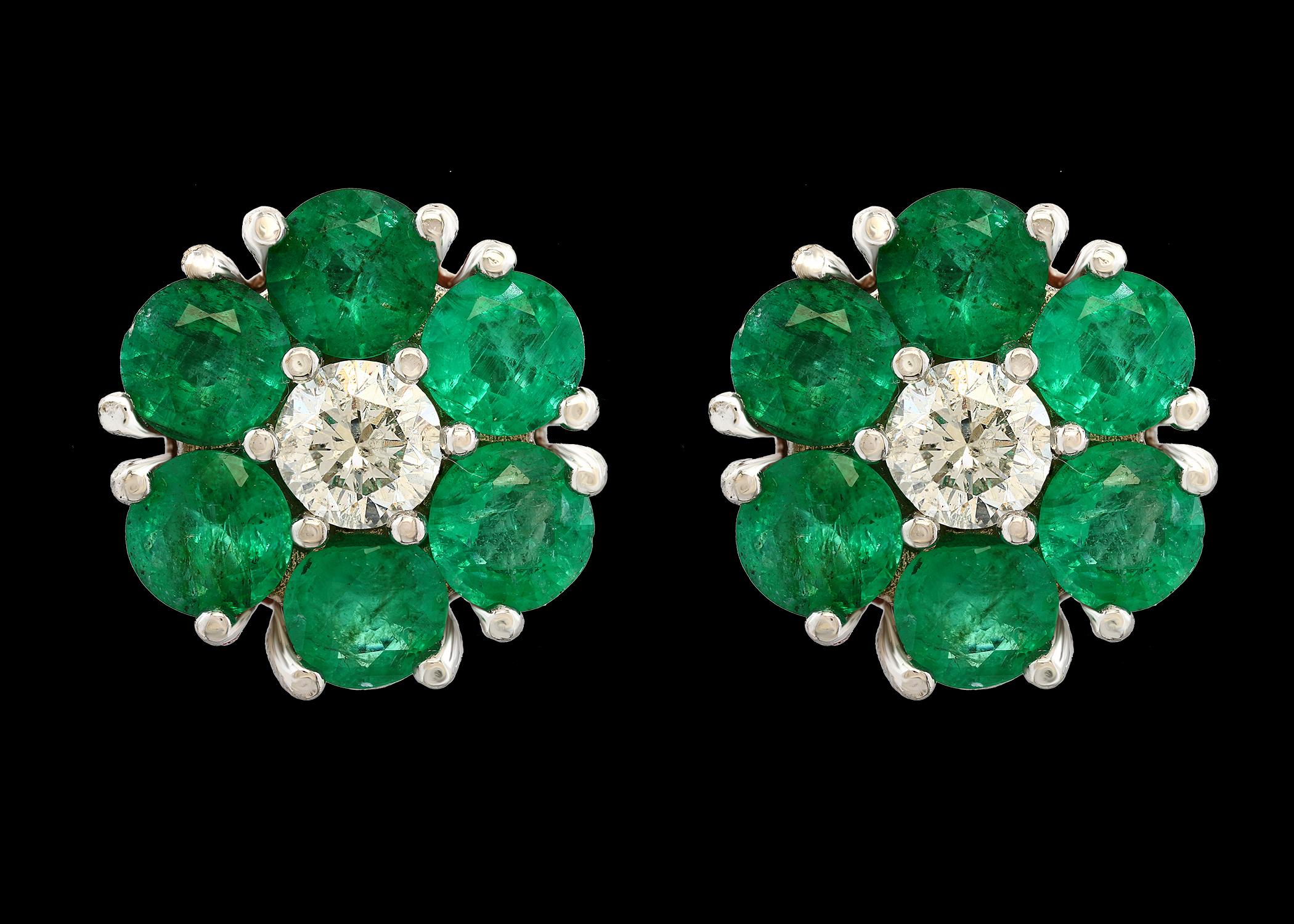 
Emerald and Solitaire Diamonds Flower Post Earrings 14 Karat White Gold 15.2MM wide flower
5 Carat  Round Cut Emerald  and 0.80  ct  solitaire diamond flower earrings
Each earring has 6 emeralds each 0.40ct , Total weight of emerald  in one earring