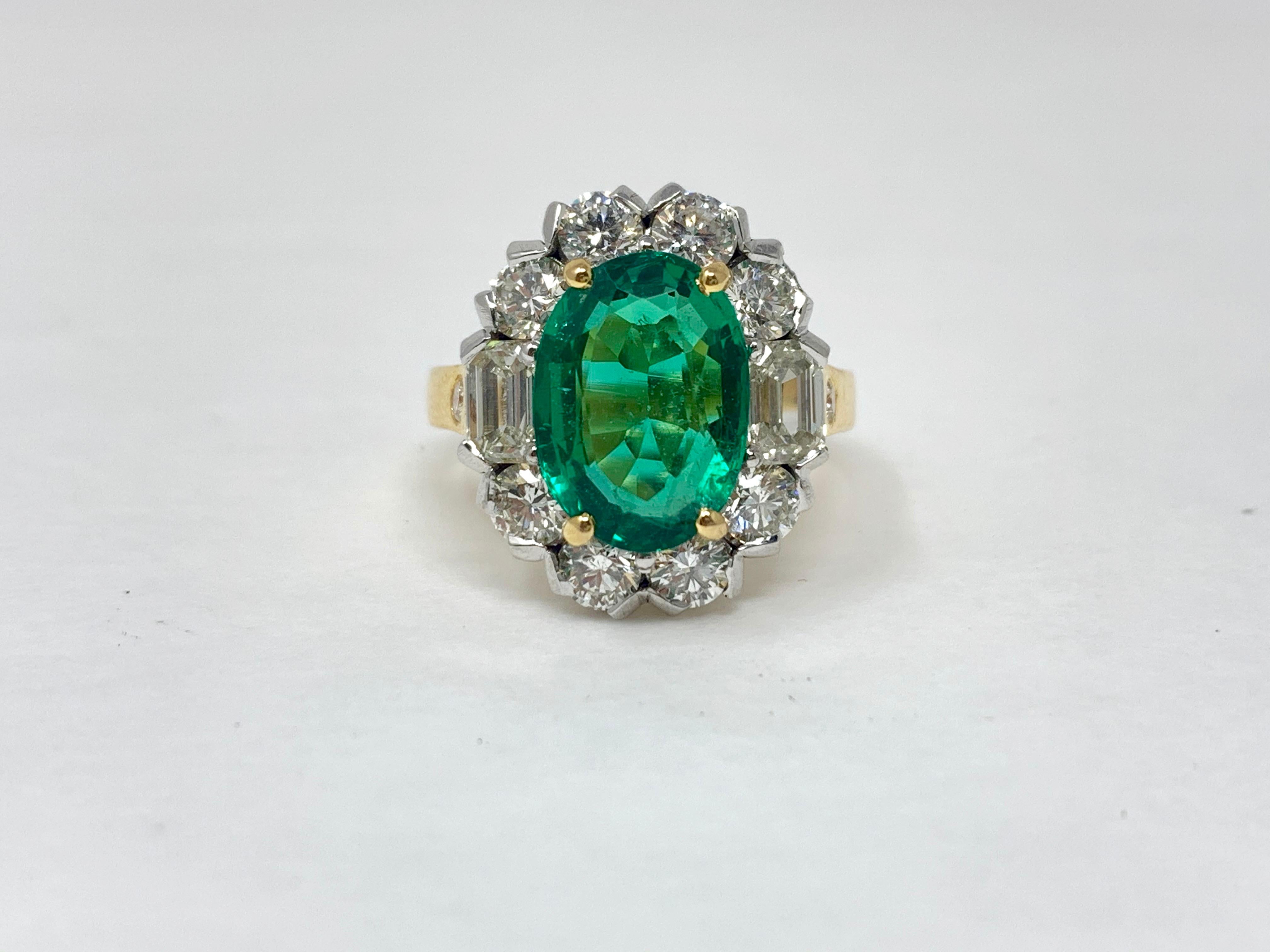 Oval Cut Emerald and White Diamond Engagement Ring in 18 Karat Yellow Gold