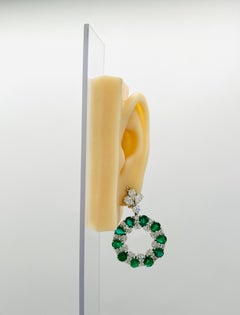 Emerald and White Diamond Pear Shape Dangle Earrings in Platinum