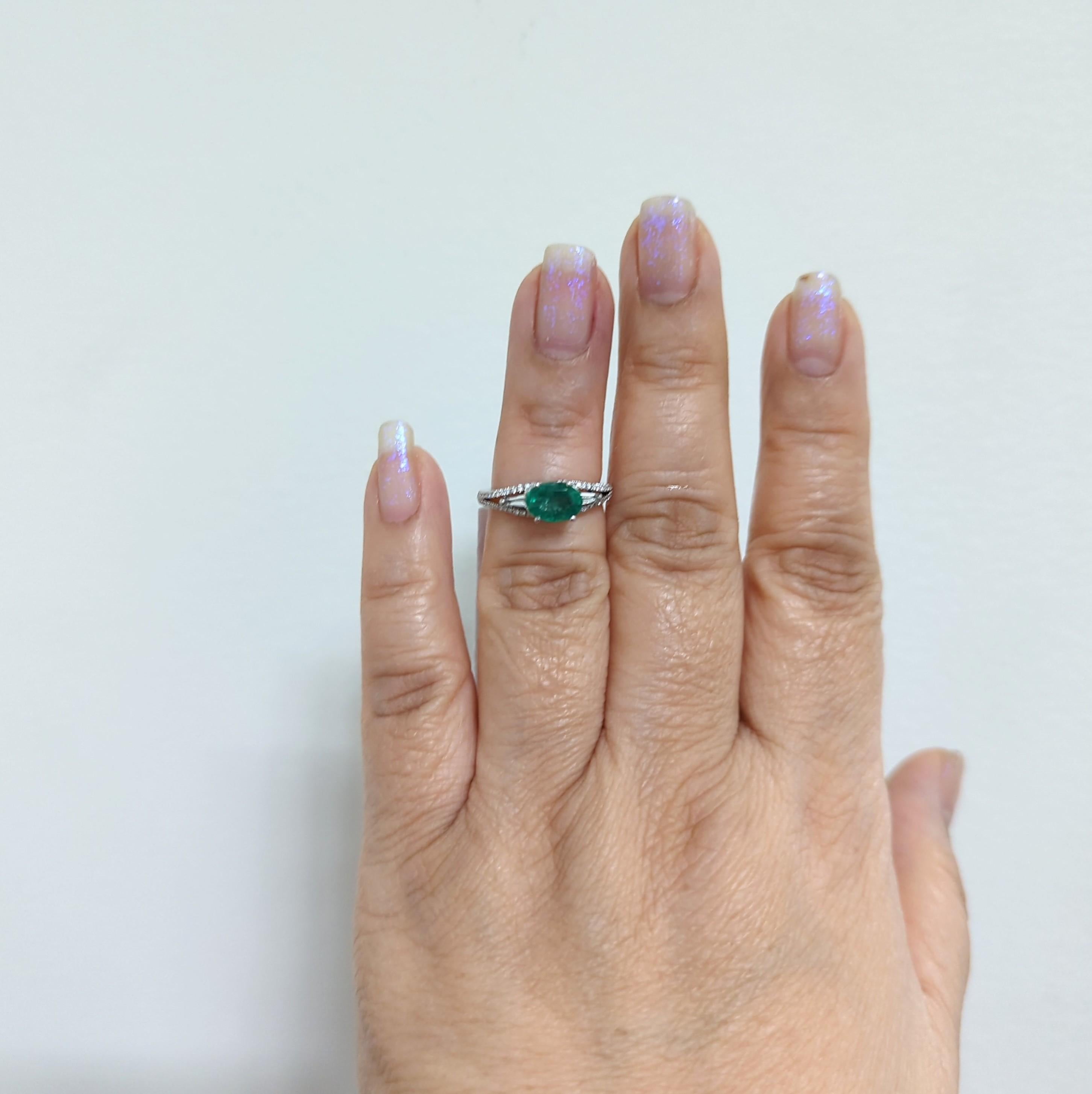 Beautiful 1.07 ct. emerald oval with good quality white diamond rounds and baguettes.  Emerald is set east to west, giving it a modern look.  Handmade in 18k white gold.  Ring size 5.75.