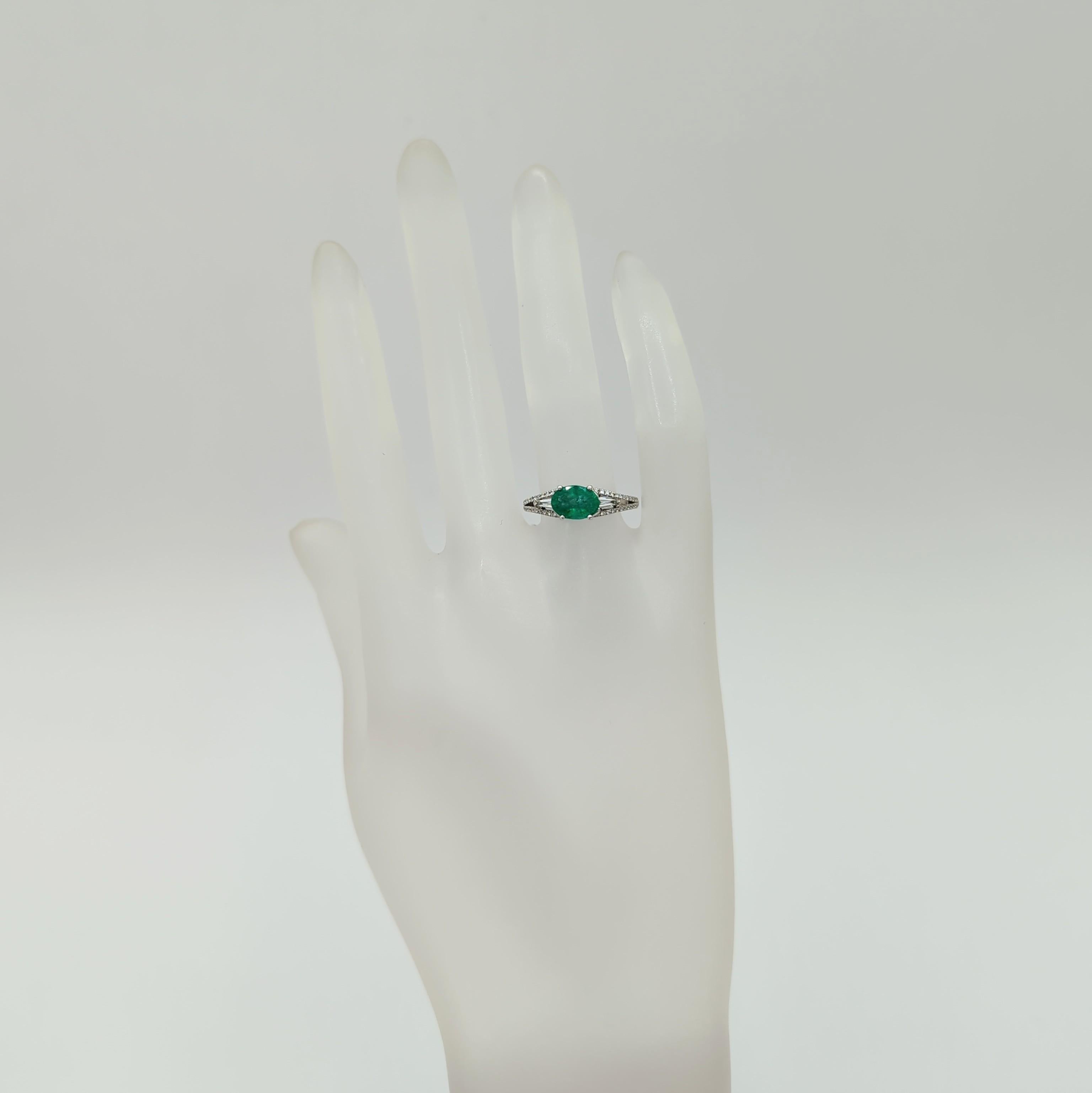 Oval Cut Emerald and White Diamond Ring in 18K White Gold For Sale