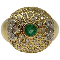 Anello con smeraldo e diamante bianco in oro giallo