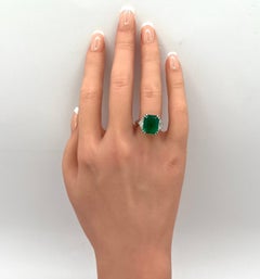 Emerald and White Diamond Three Stone Ring in 18K White Gold