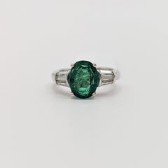Emerald and White Diamond Three Stone Ring in 18K White Gold