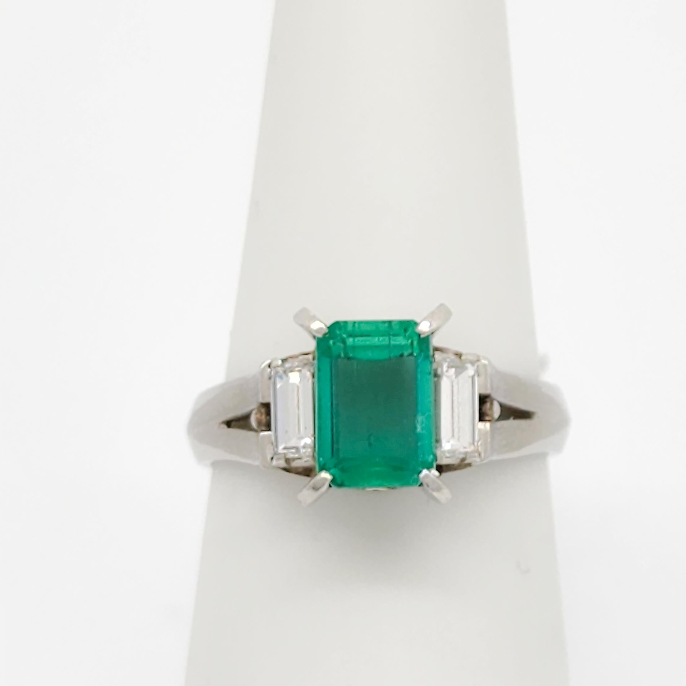 Women's or Men's Emerald and White Diamond Three Stone Ring in Platinum