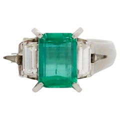 Emerald and White Diamond Three Stone Ring in Platinum