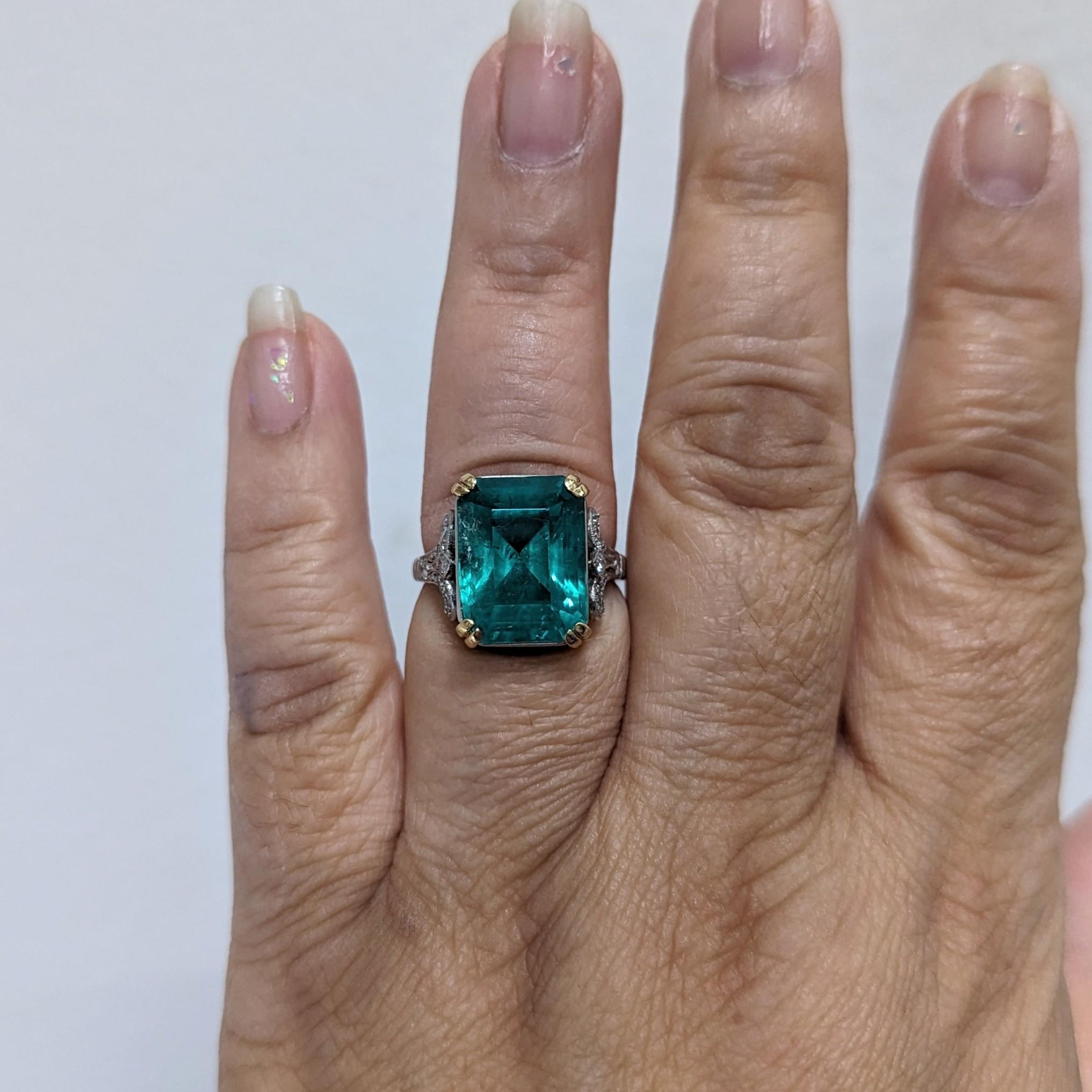 Gorgeous 8.61 ct. emerald emerald cut with good quality, white, and bright diamond rose cut rounds.  Handmade in platinum and 18k yellow gold.  Ring size 7.5.