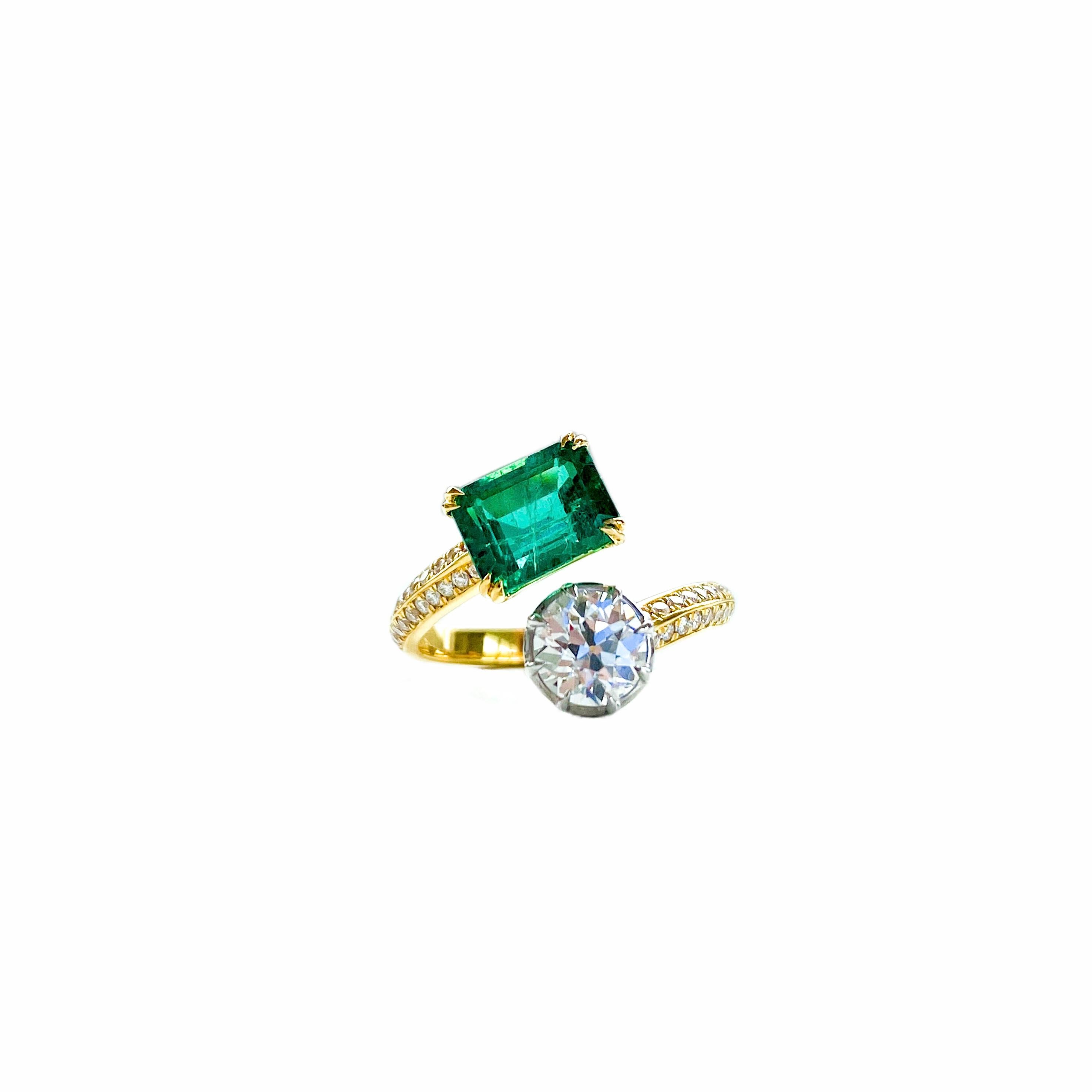 Beautiful toi et moi ring. 

1.71ct Zambian Vivid Green Emerald with excellent clarity and little inclusions. 
0.71ct Antique Old European cut Diamond with GIA certificate, J colour SI2 clarity. 

The diamond looks completely eye clean and faces up