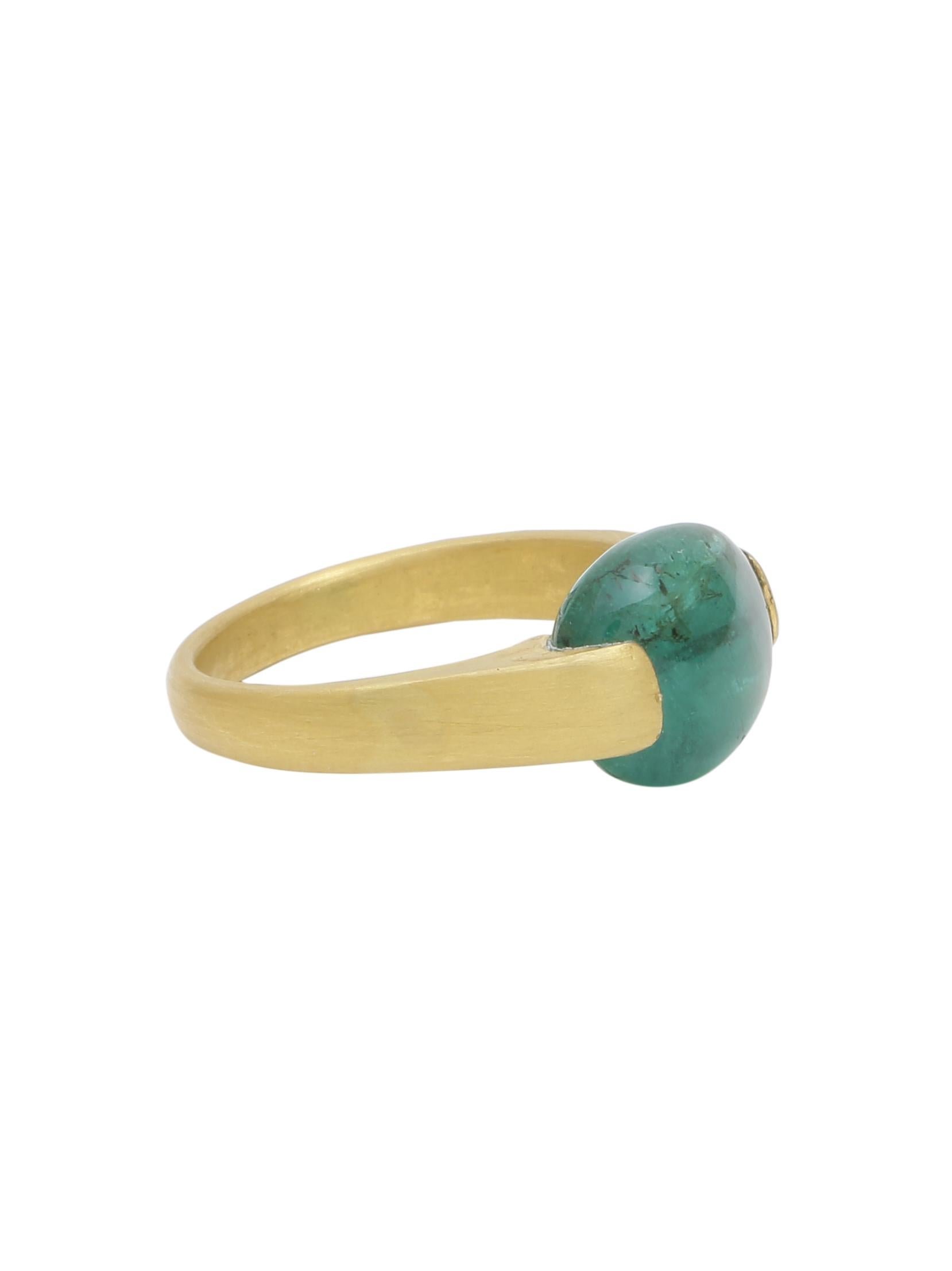 A beautiful and unique Emerald ring. In the ring you will see an Emerald Bead carefully set in the ring with Gold wire. The unique ring is handmade in 18K Yellow Gold in matte finish. The Zambian Emerald in the ring weighs 5.96 carats. And the total