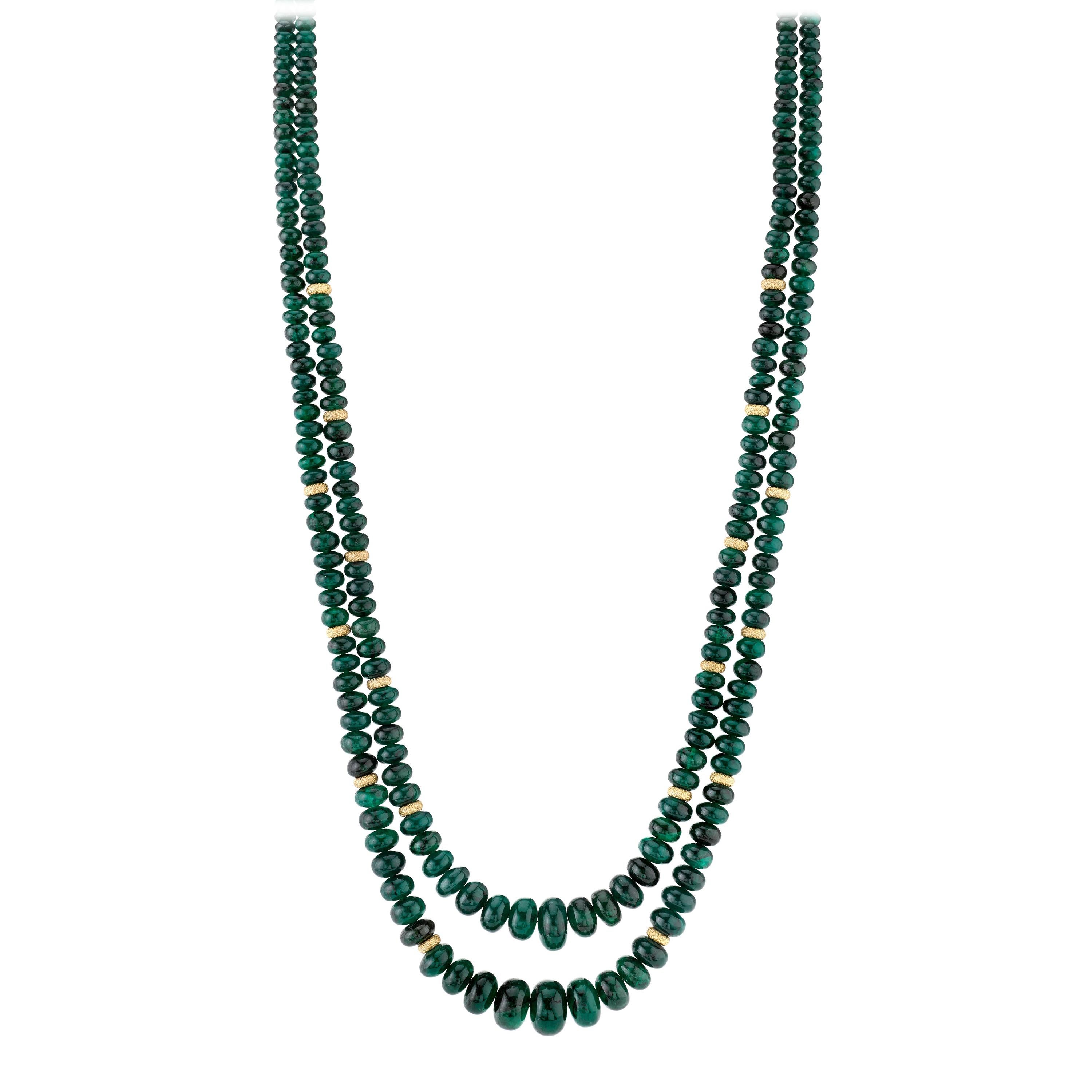 This double strand of emerald beads is stunning! The emerald beads possess both rich color and vibrancy, and are well-matched for color and translucence. Hand strung with 14k yellow gold spacers, this necklace is very versatile; a piece you can wear