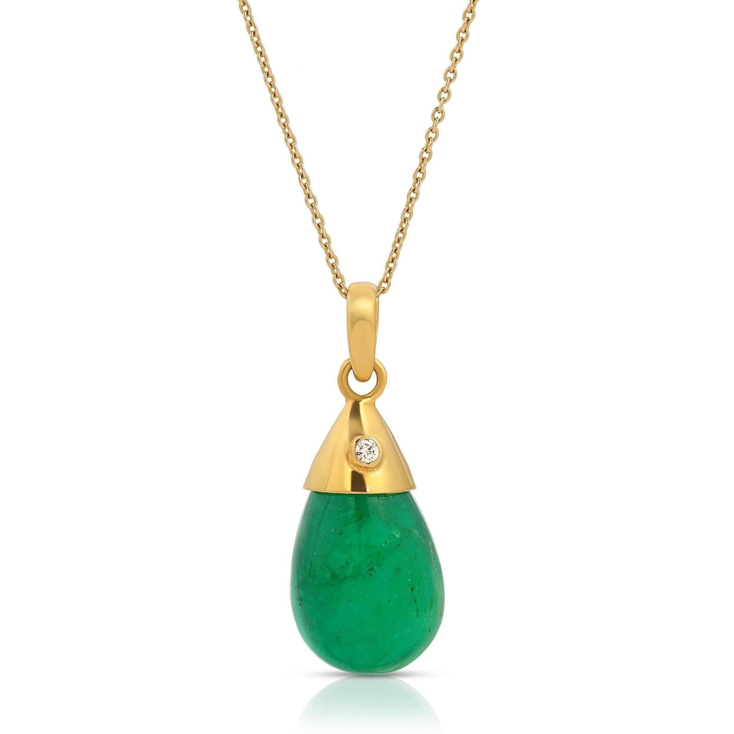 Emerald Bean Diamond Pendant. A beautiful natural pear shaped luminous emerald suspended by a gold cap encasing a single brilliant cut diamond. A spectacularly chic one of a kind pendant.

- Natural cabochon Emerald 10.2 carats.
- Brilliant cut