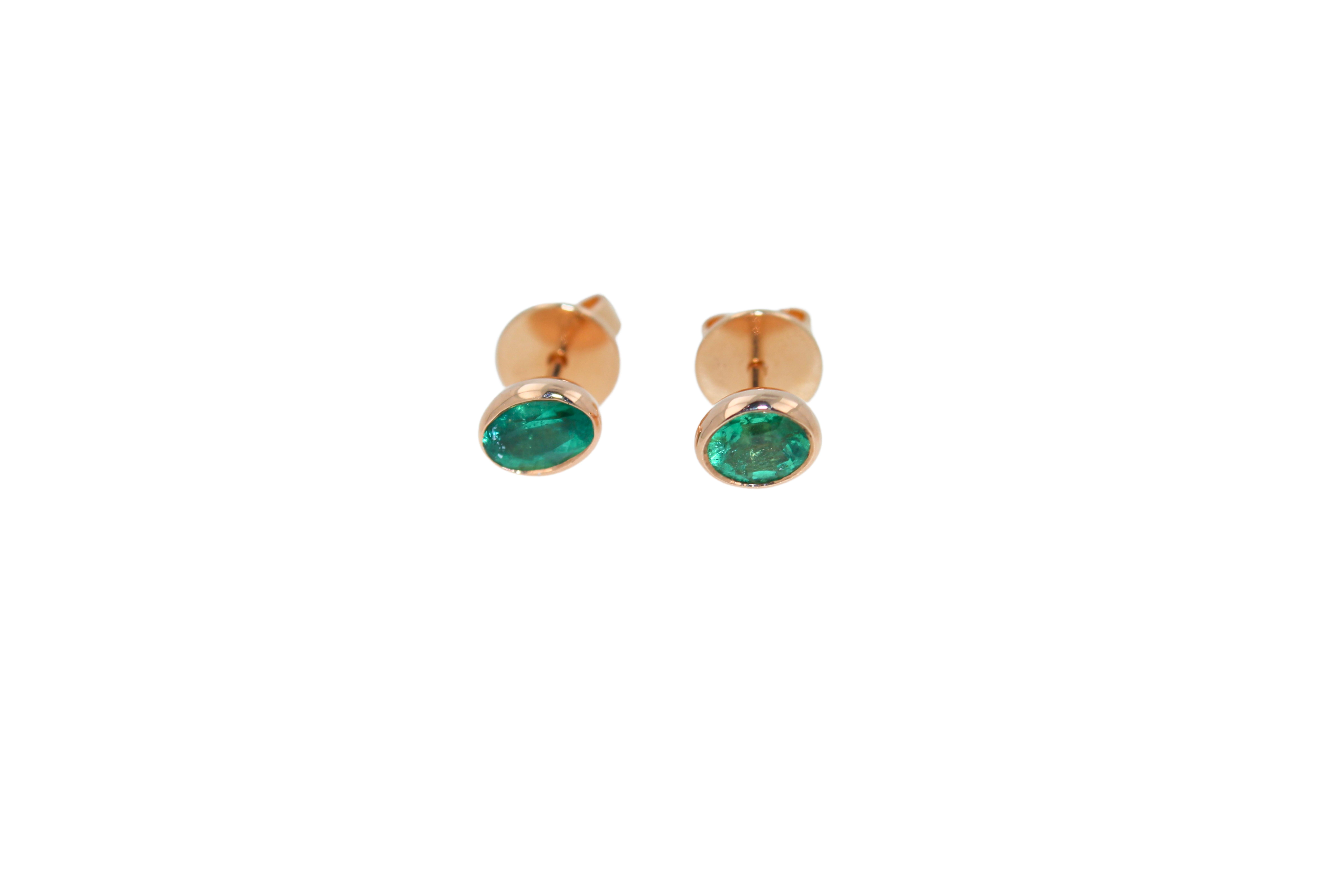 Emerald Bezel Earrings
Small Stud Earrings
Full Bezel Set
18k Rose Gold 
Oval-Shape 
Genuine Emeralds 
Beautiful, Medium Vivid Green Color 
Around 1.2 Carats Total Weight
High-Quality, Make, Polished Finish