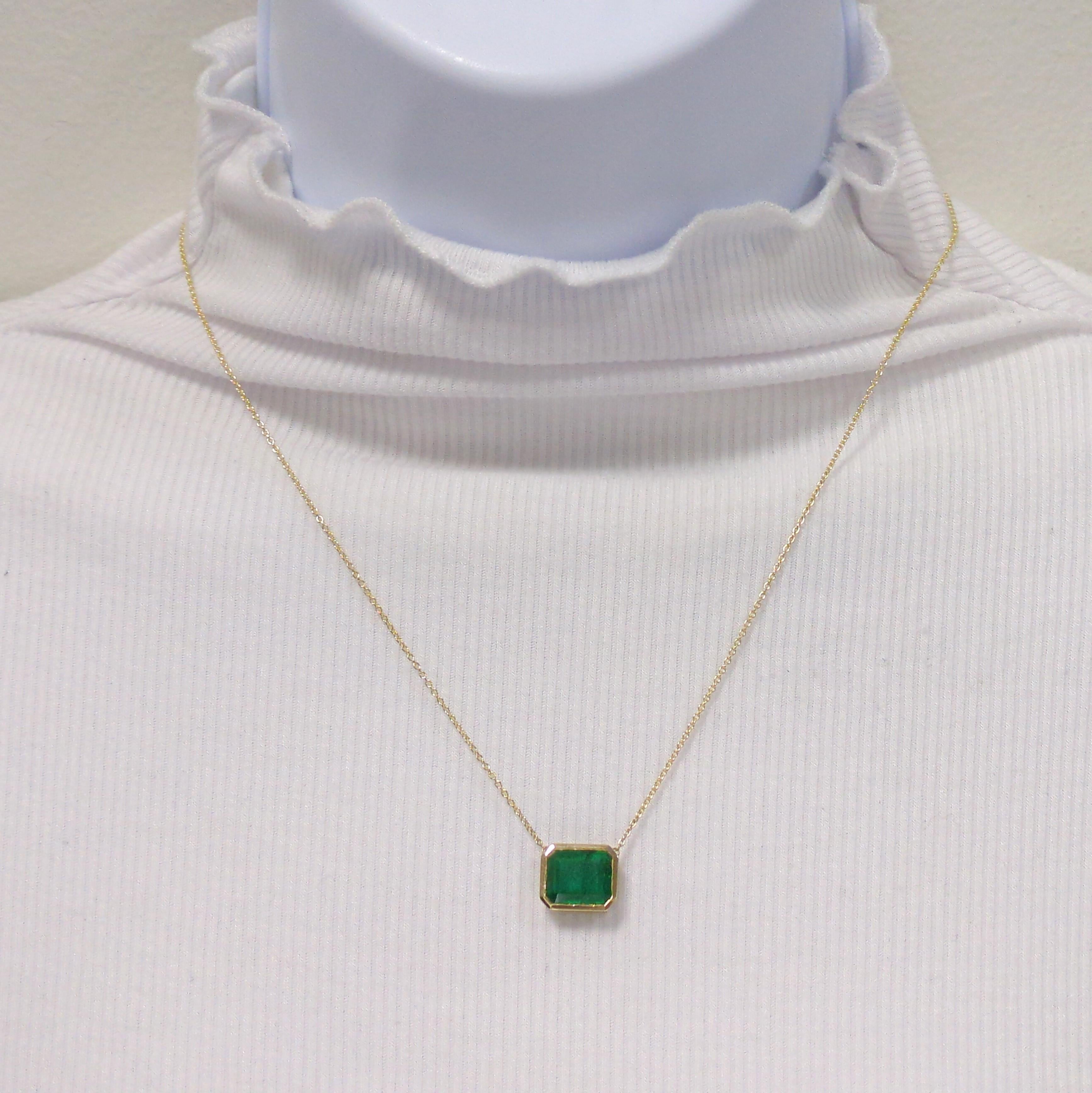Beautiful 3.78 ct. emerald emerald cut in a handmade 18k yellow gold bezel and 18