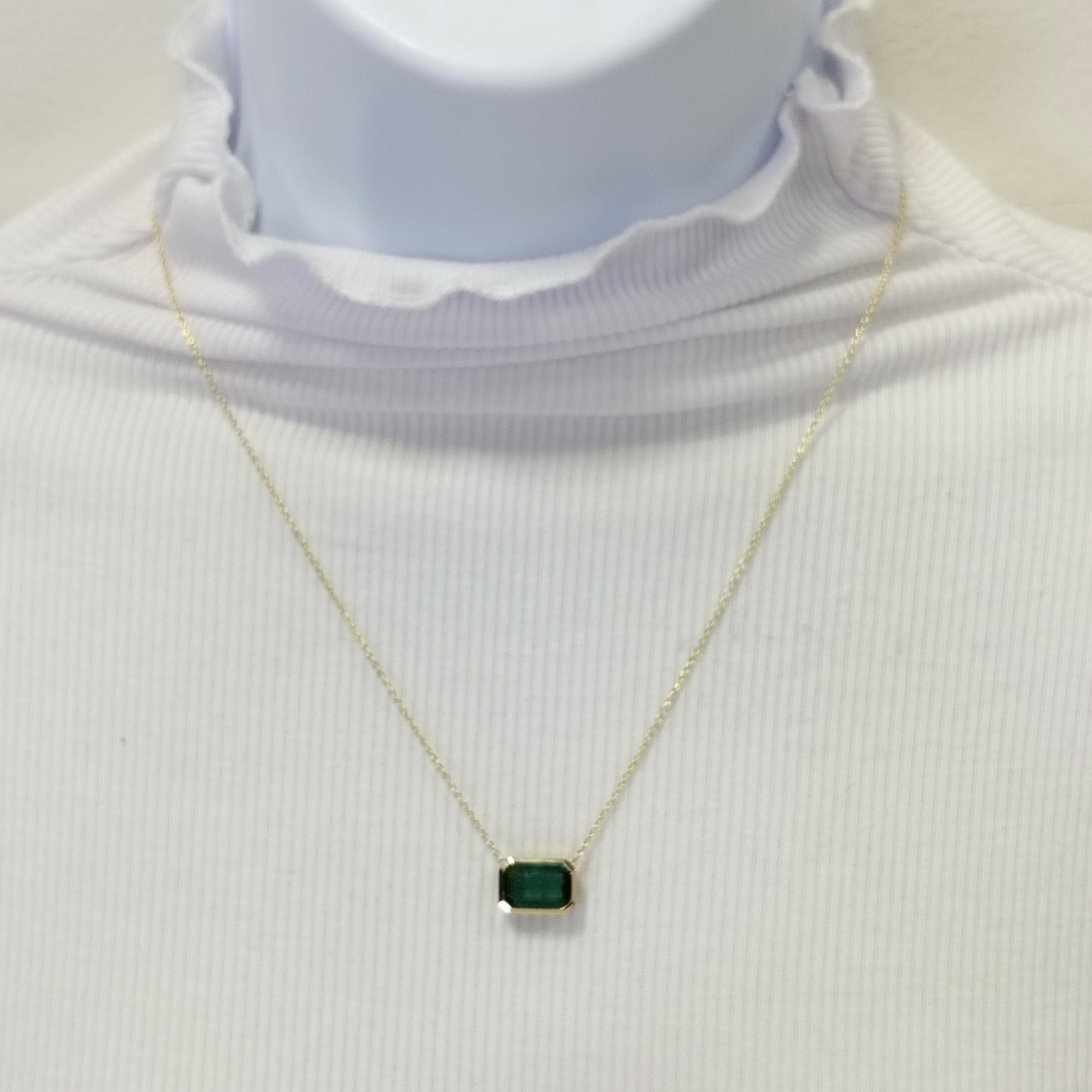 Beautiful 3.40 ct. emerald emerald cut handmade in 18k yellow gold.  Length is 18