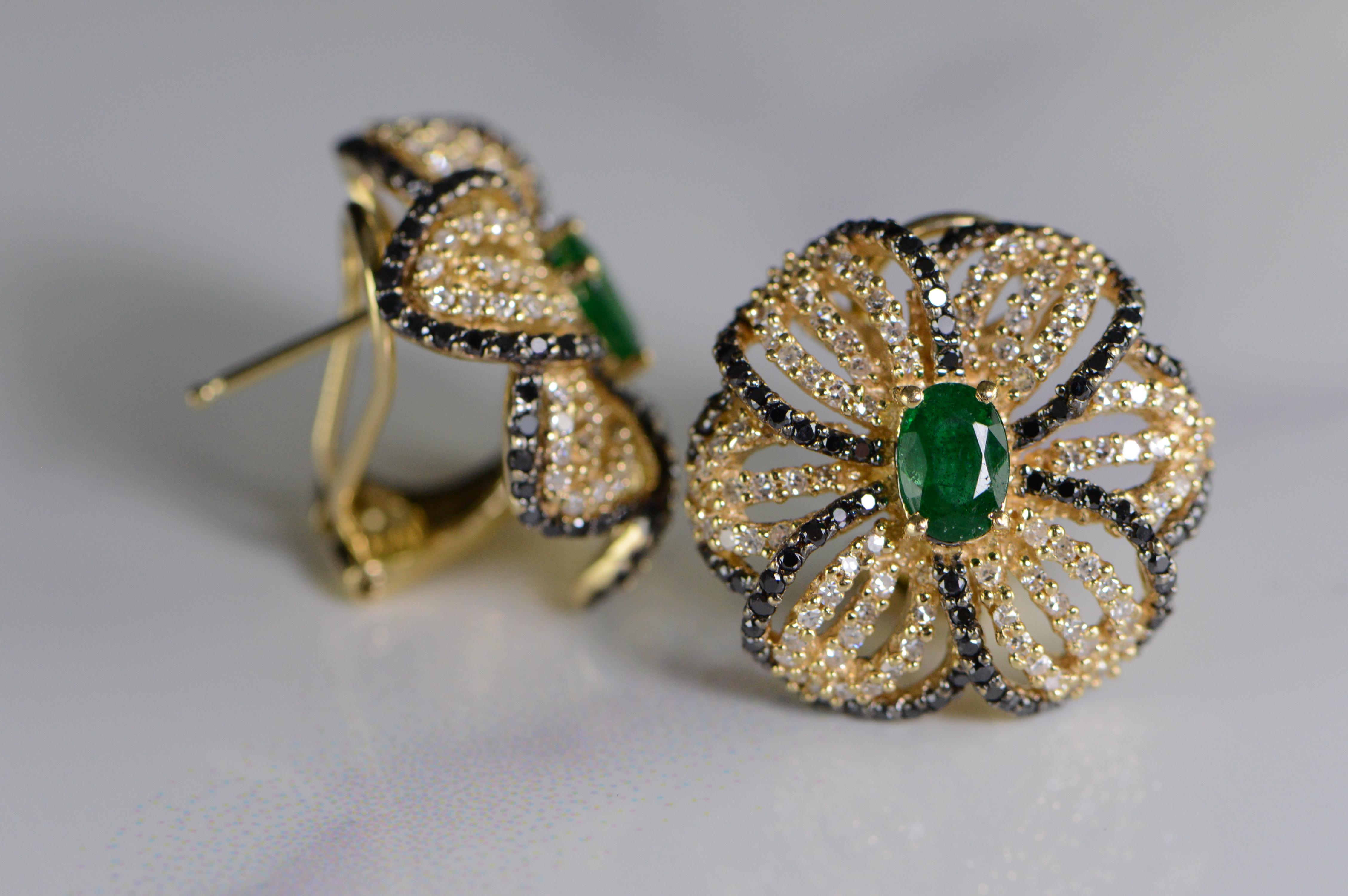 All diamonds are graded according to GIA grading standards. 
 ·Item: 14K 3.07 CTW Emerald Black & White Diamond Flower French Clip Earrings Yellow Gold 
 ·Era: Modern / 2000s  ·Composition: 14k Gold Marked/Tested  
·Gem Stone: 2x Emeralds=1.00ctw,