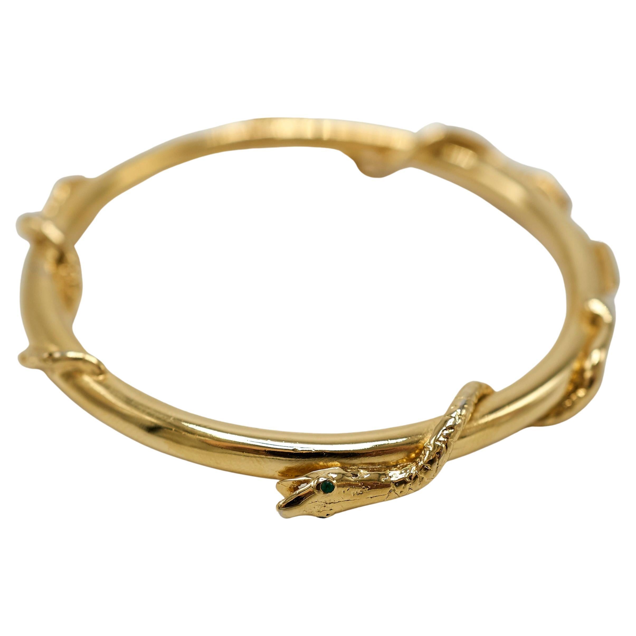 Materials: Gold Plated  Set with Emerald, Black Diamond, and White Diamond
Style: Three Snake Bangle Bracelet  Animal Jewelry  Symbolic Fine Jewelry
Production: Made to order – ships in 2–4 weeks
Origin: Handmade in Los Angeles

This Three Snake