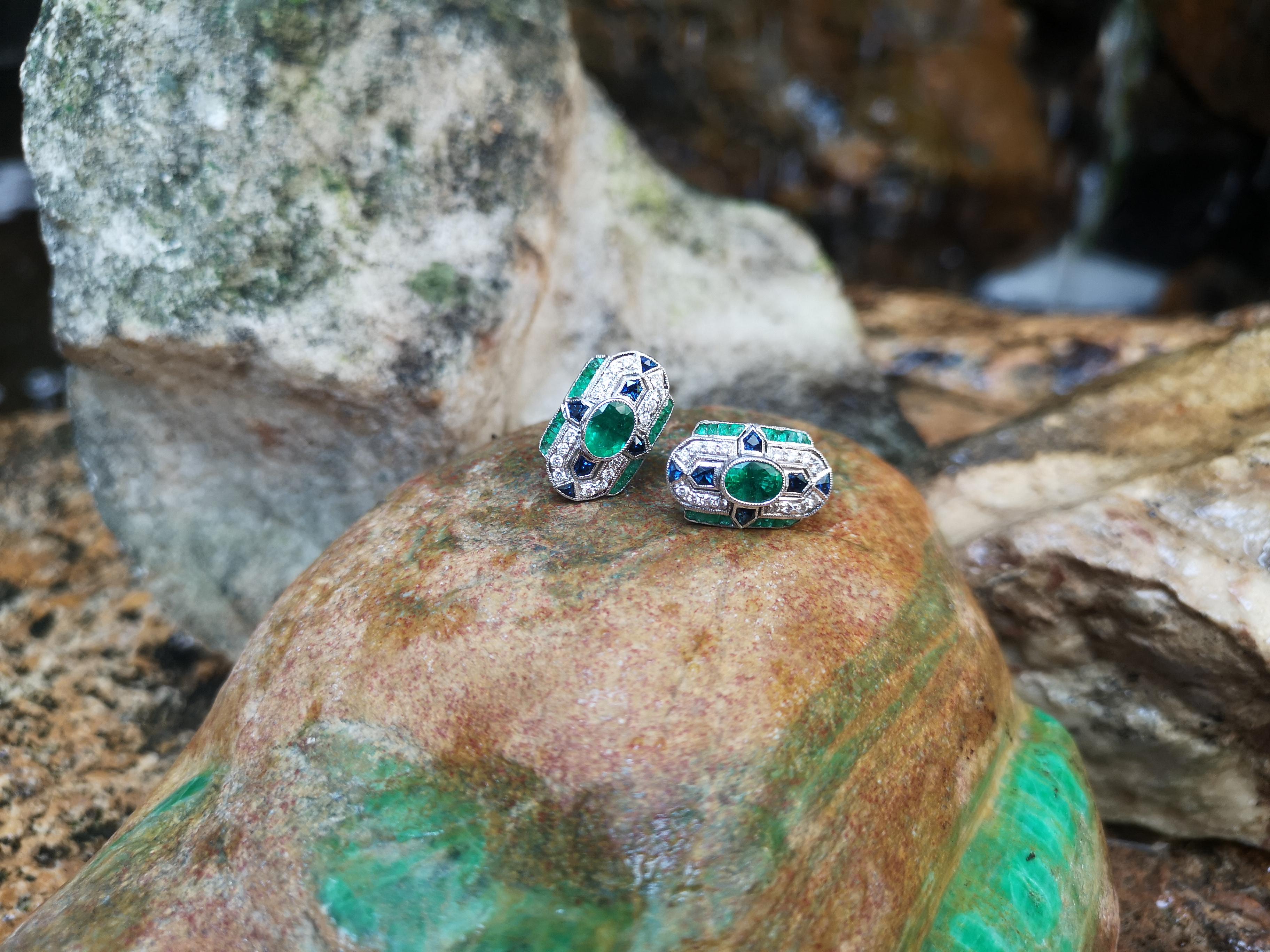 Oval Cut Emerald, Blue Sapphire and Diamond Earrings Set in 18 Karat White Gold Settings