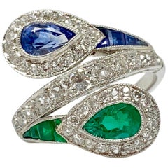 Anello gemello con smeraldo, zaffiro blu e diamante bianco in platino