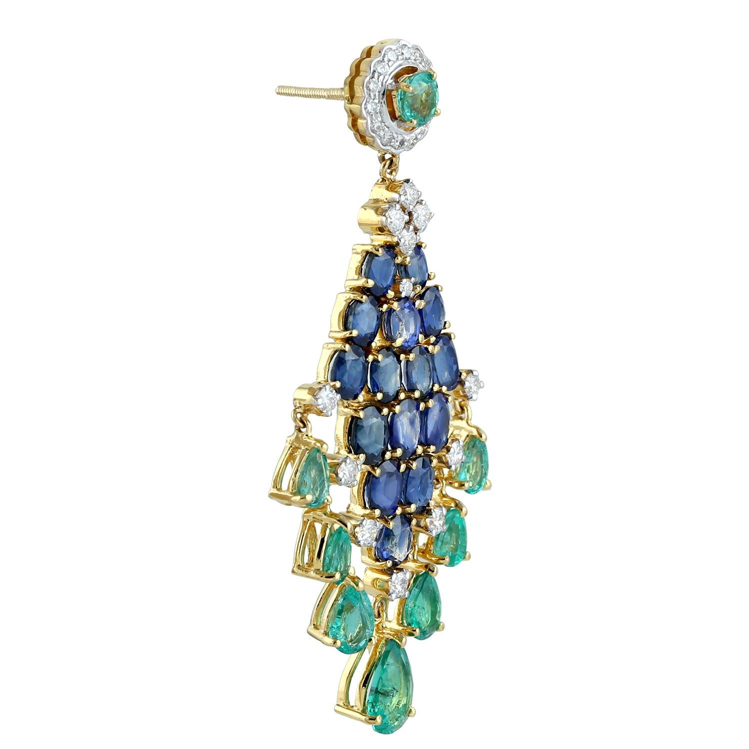 Cast from 18-karat gold.  These beautiful chandelier earrings are hand set with 7.7 carats emerald, 8.51 carats blue sapphire and 1.25 carats of sparkling diamonds.

FOLLOW  MEGHNA JEWELS storefront to view the latest collection & exclusive pieces. 