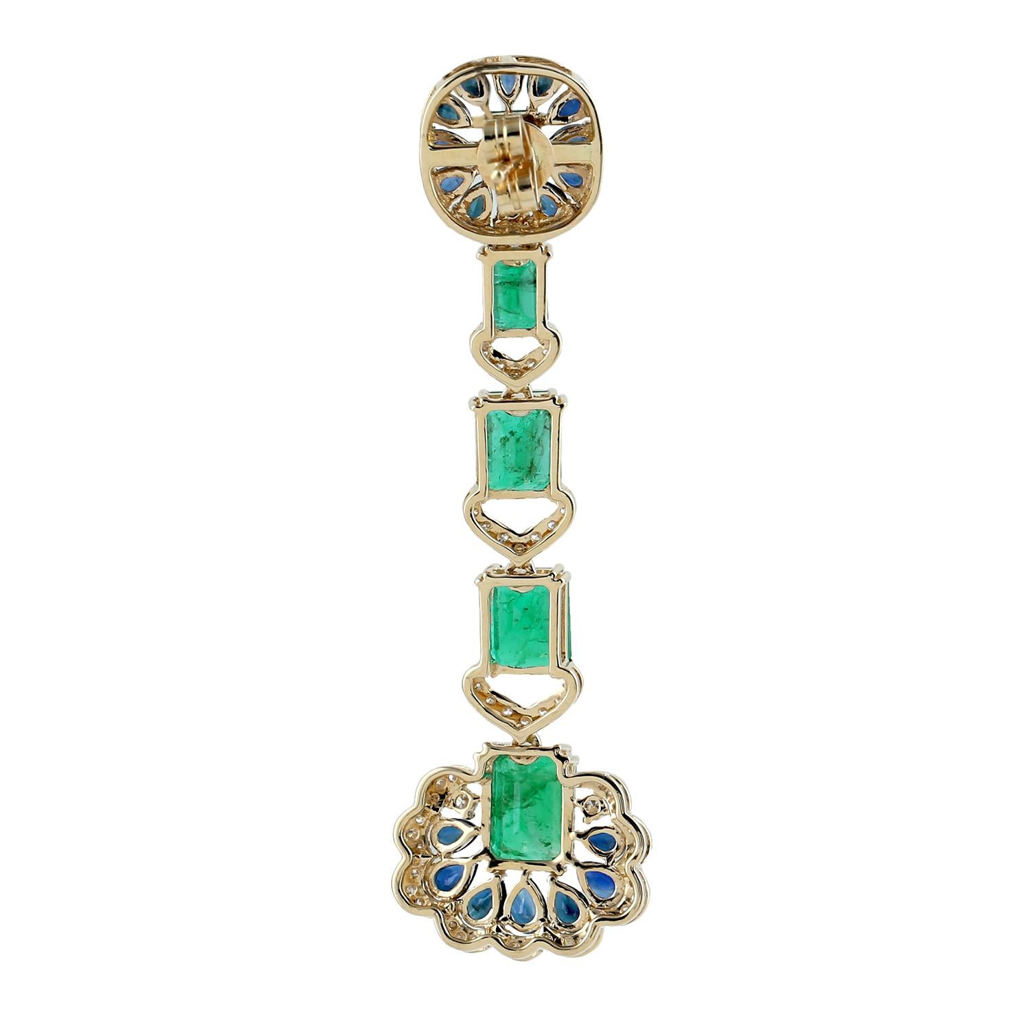 Cast from 18-karat gold.  These beautiful earrings are hand set with 11.05 carats emerald, 6.15 carats blue sapphire and 1.1 carats of sparkling diamonds.

FOLLOW  MEGHNA JEWELS storefront to view the latest collection & exclusive pieces.  Meghna