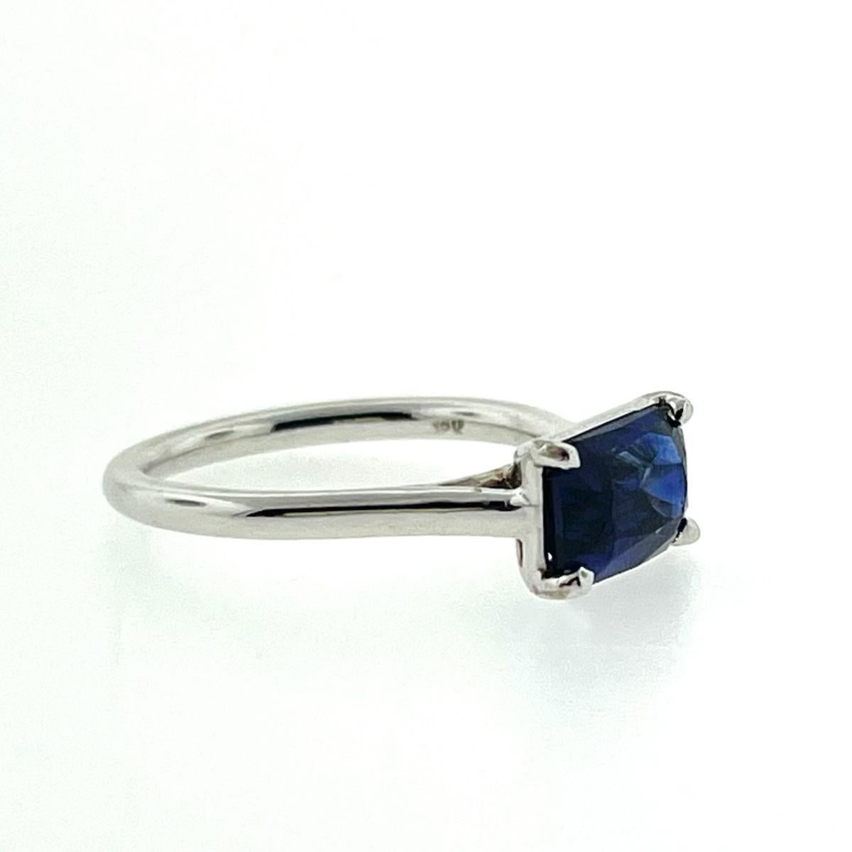 Single Emerald Cut Blue Sapphire weighing 2.33cts Set in a 18K White Gold Ring. The ring is currently a size 6 but can be resized. 
