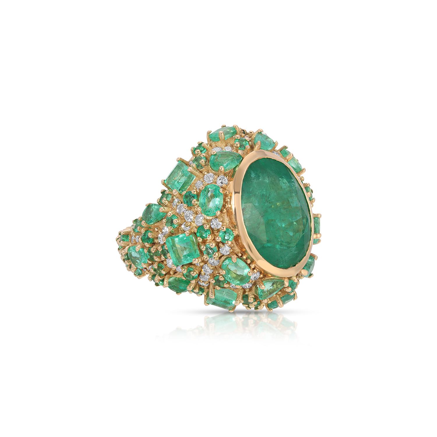 The Emerald Bomba Diamond Cocktail Ring… a masterpiece of luxurious high jewelry. Crafted from fiery emerald baguettes, brilliant cut diamonds and starring a 15.23 Columbian Emerald of exalted luminosity, this exceptional piece define the glamorous