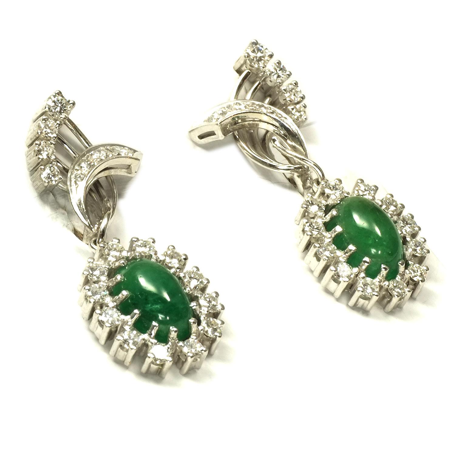 Emerald Cabochon and 2.6 Carat Diamond Clip On Drop Earrings in 18K White Gold

Classically elegant clip-on earrings in a stylized leaf shape each set with 9 brilliant-cut diamonds, underneath each an oval emerald cabochon mounted in an entourage of
