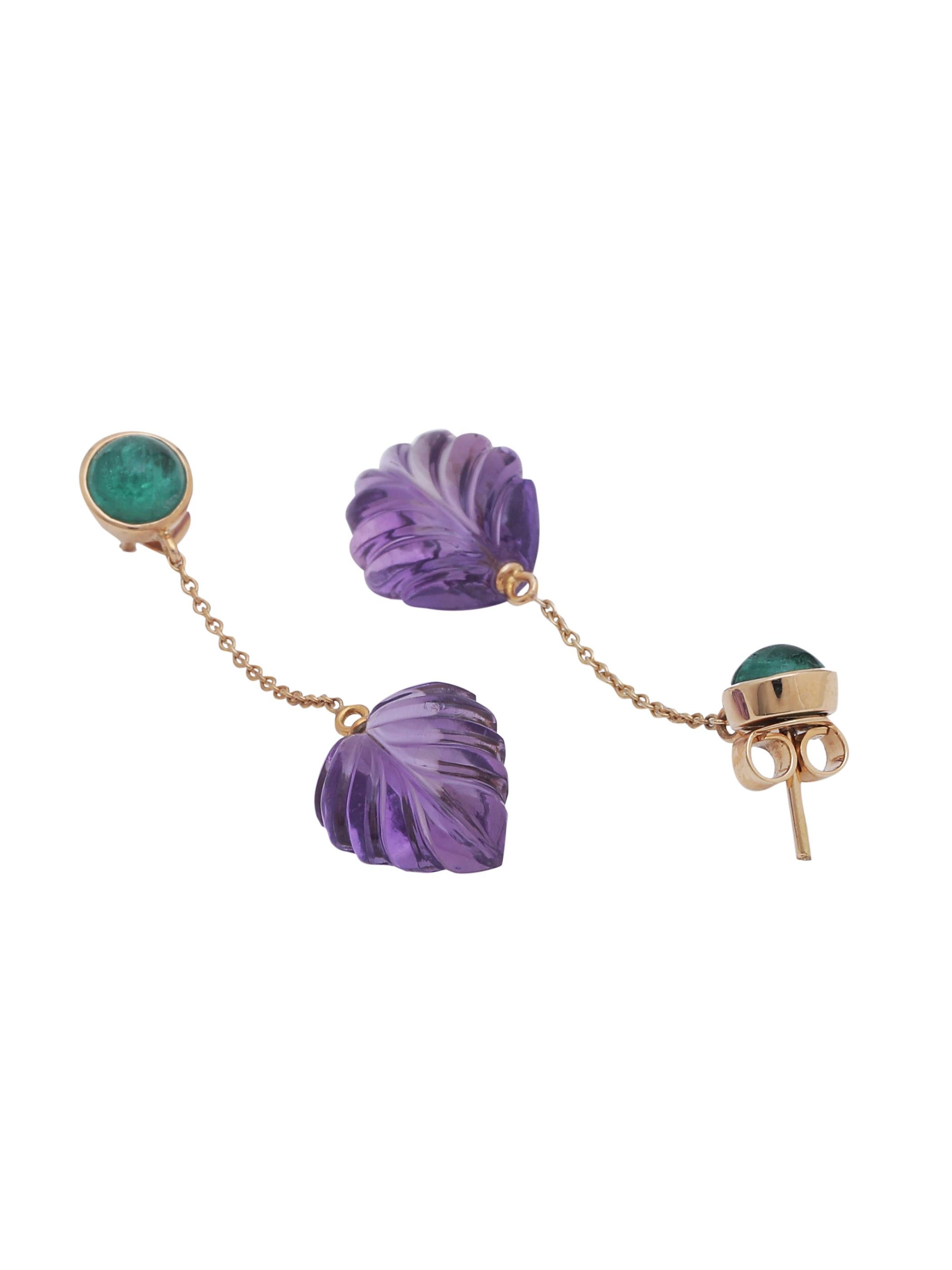 A pair of petit chain earring with a pair of Zambian Emerald Round Cabochon and a hanging pair of beautifully hand carved Amethyst leaves. The earring was handmade by our trained artisans. The chain in the middle makes the Amethyst move a little