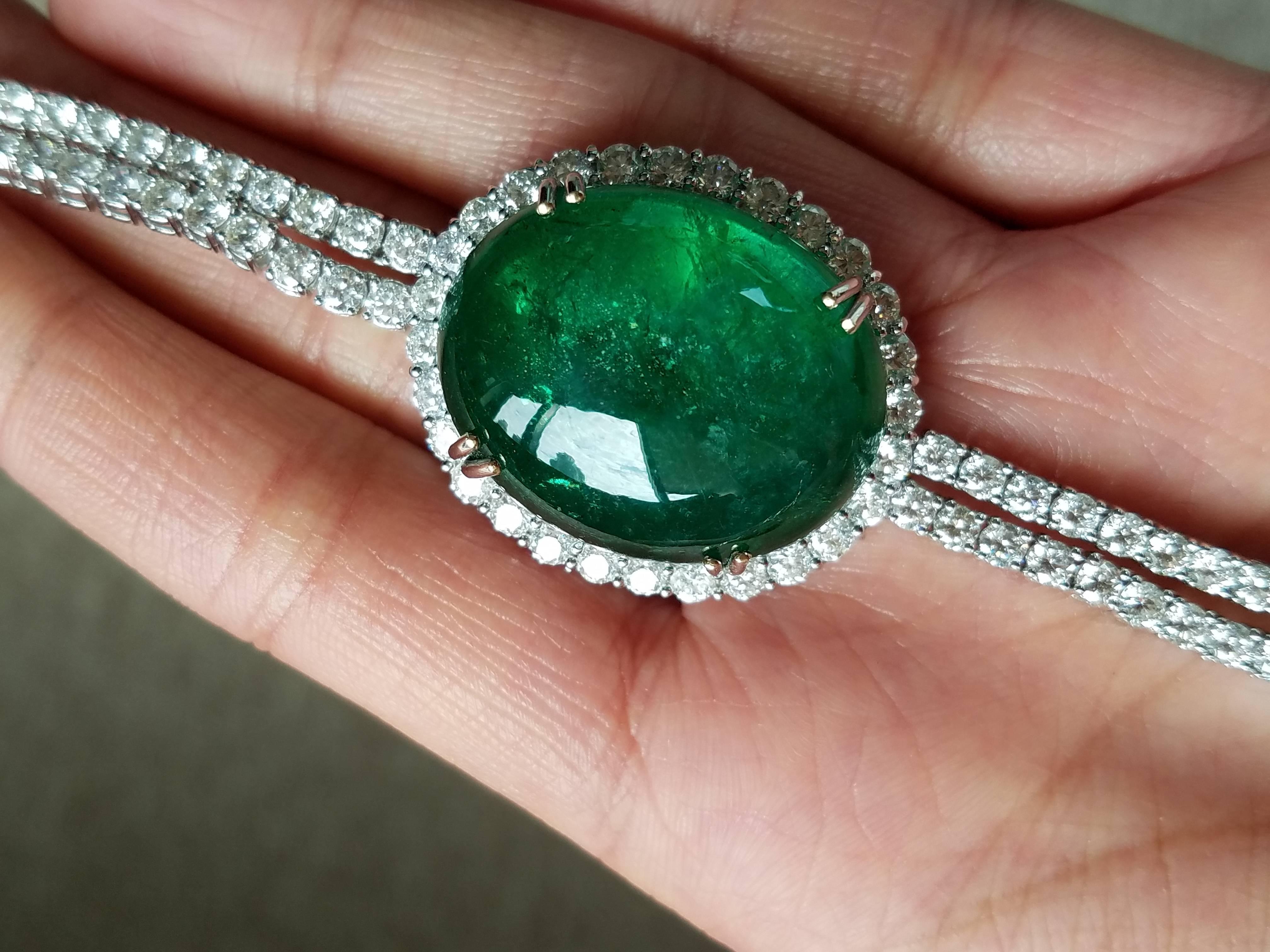 Magnificent emerald and diamond suite of jewellery, comprising a necklace, ring and earrings. A very elegant necklace, earring and ring set - using Emerald Cabochons/Drops and White Diamond, all set in 18K white gold. 

Necklace Details: 57.7 Carats