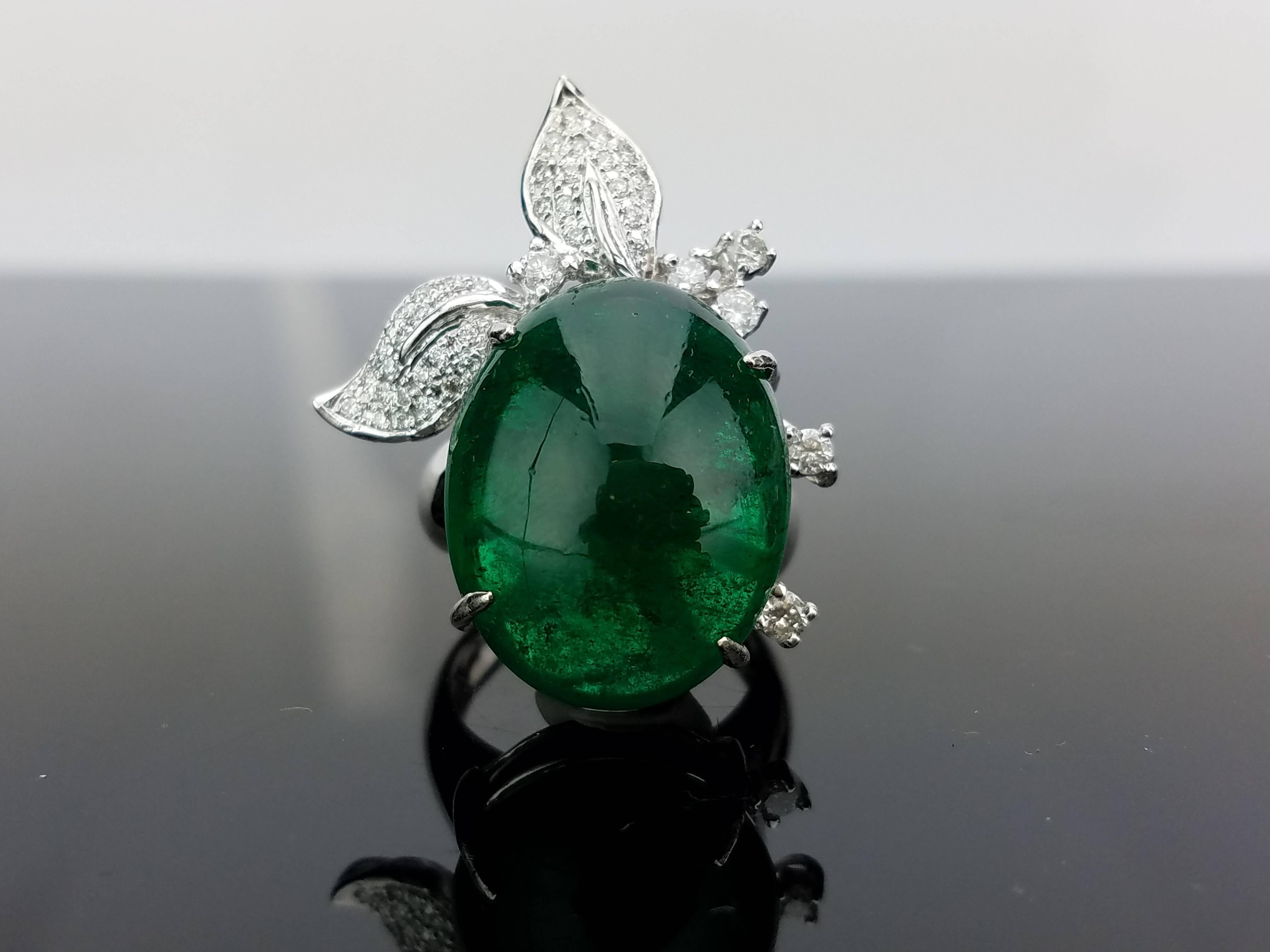 A statement jewellery suite, comprising of ring and earring (with omega backing) using Zambian Emerald Cabochon stones and Diamonds, all set in 18K White Gold

Ring Details:  Emerald Cab 26.20 carat / Diamond 1.27 carat
Earring Details:  Emerald Cab