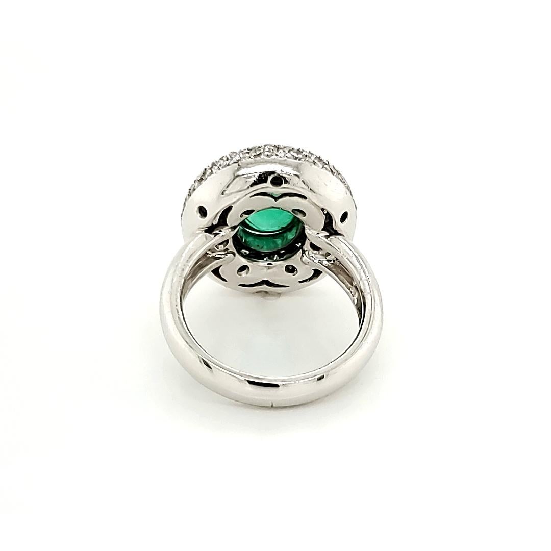 Emerald Cabochon And Diamond Halo Ring:

An Intense Green Cabochon Emerald weighing 2.49 carat, surrounded by a halo of White Diamonds weighing 1.26 carat. Although a simple design, the regal look of the Emerald makes the ring ever so important.