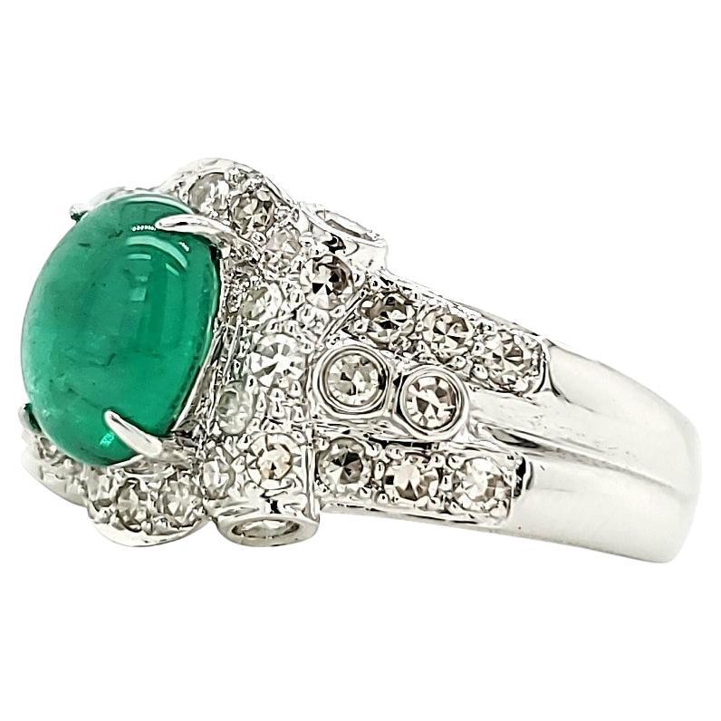 Emerald Cabochon And Diamond White Gold Engagement Ring:

A bright green Emerald Cabochon weighing 1.47 carat accented by a variety of White Diamonds of fine quality weighing 0.67 carat, this ring is a great option for an engagement ring! The