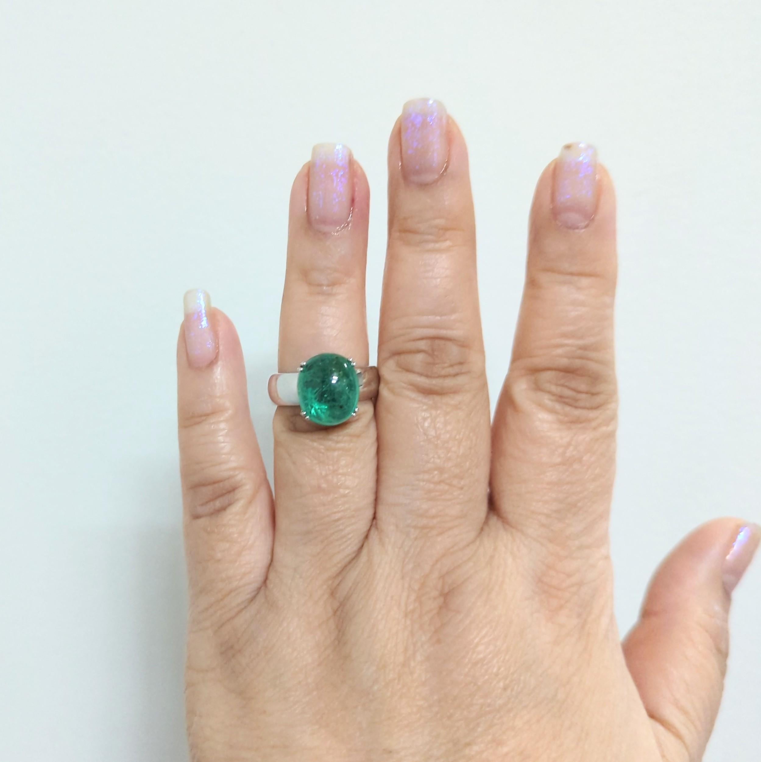 Beautiful 7.42 ct. emerald oval cabochon.  Handmade in 14k white gold.  Ring size 7.5.