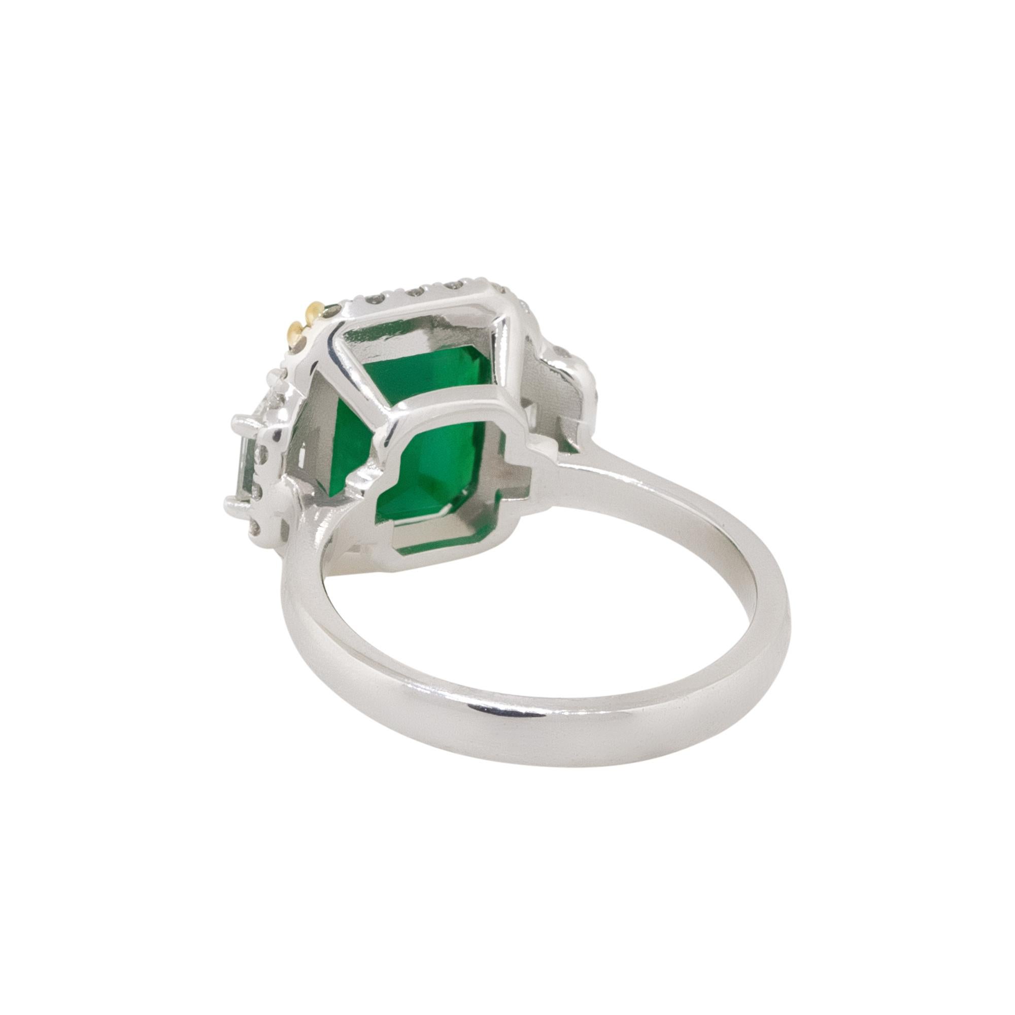 Women's Emerald Center Diamond Halo Three Stone Ring 18 Karat in Stock For Sale