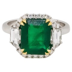 Emerald Center Diamond Halo Three Stone Ring 18 Karat in Stock