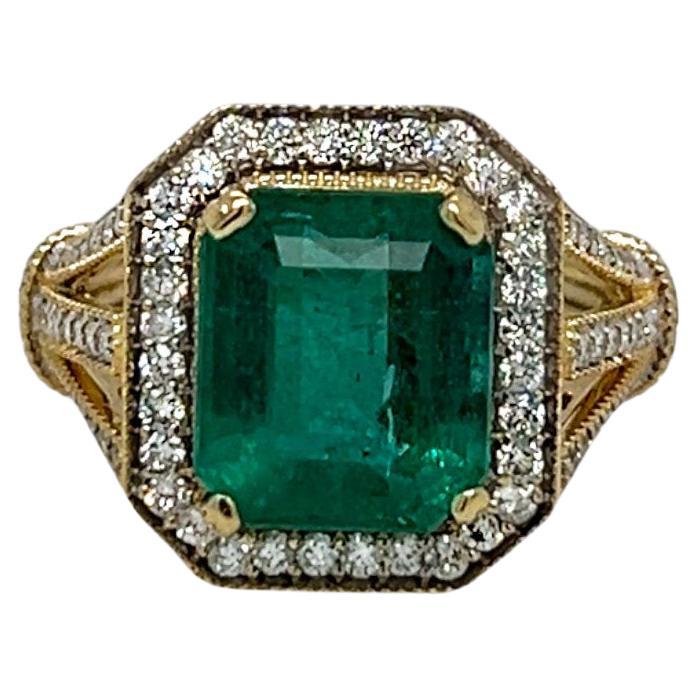 Emerald Center Stone with Diamond Halo Yellow Gold Statement Ring