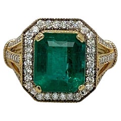 Emerald Center Stone with Diamond Halo Yellow Gold Statement Ring