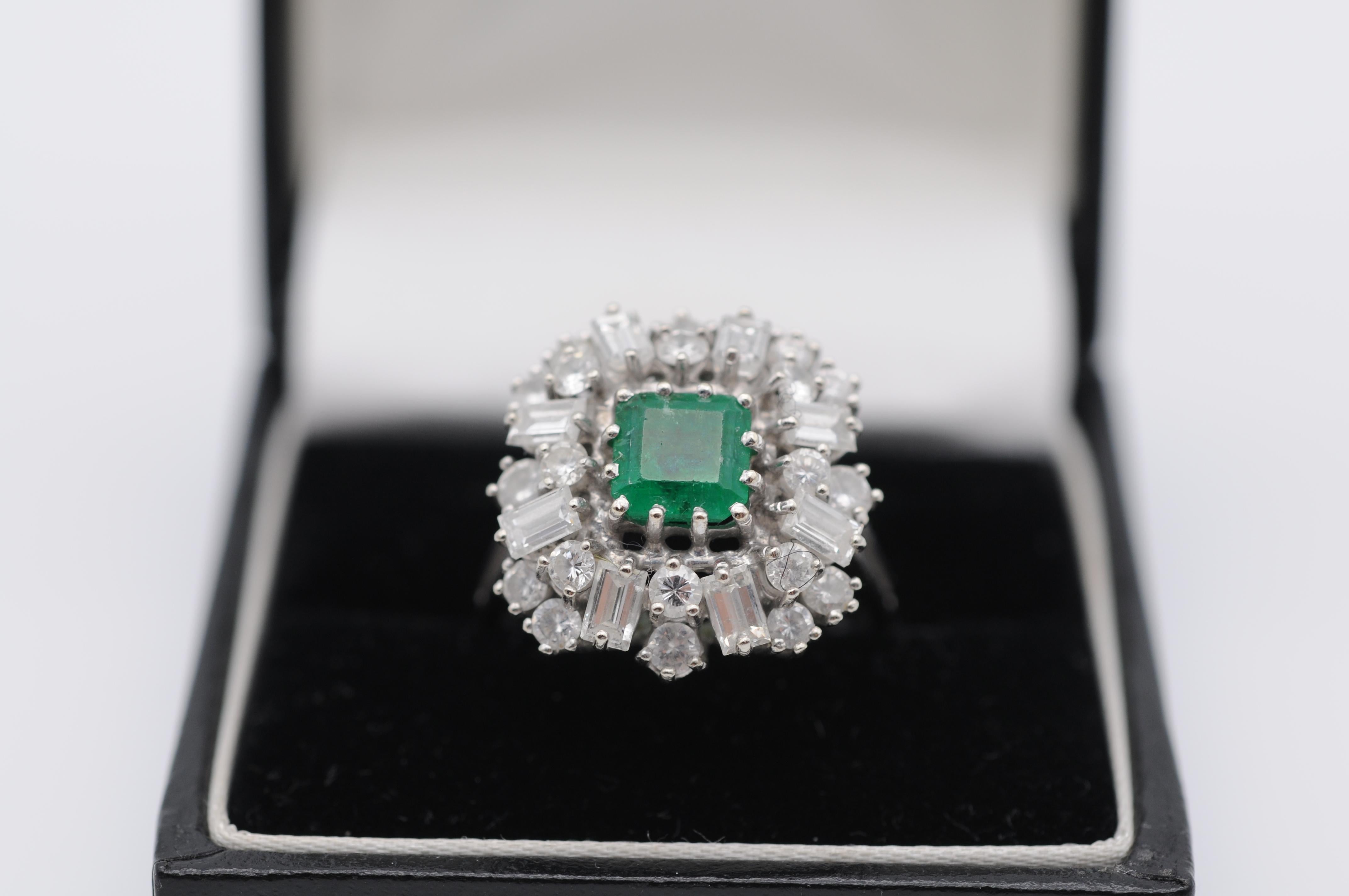 This exquisite emerald ring is a true symbol of luxury and refinement. Crafted from 14k white gold, this ring band showcases a breathtaking emerald at its center, weighing approximately 1.32 carats. The emerald boasts a gorgeous table cut that adds