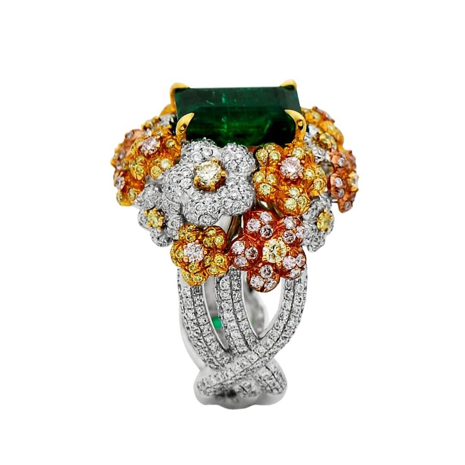 18 Karat white, yellow and pink gold Emerald Cluster ring from Laviere's Veronese Green Collection. The ring is set with a 4.82 carat GRS emerald adorned with 2.39 carat white, fancy pink and fancy yellow diamonds.  
Gross Weight of the Ring: 19.10