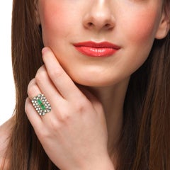 Carved Emerald Ring Surrounded by Rose Cut Diamods with Filigree Shank