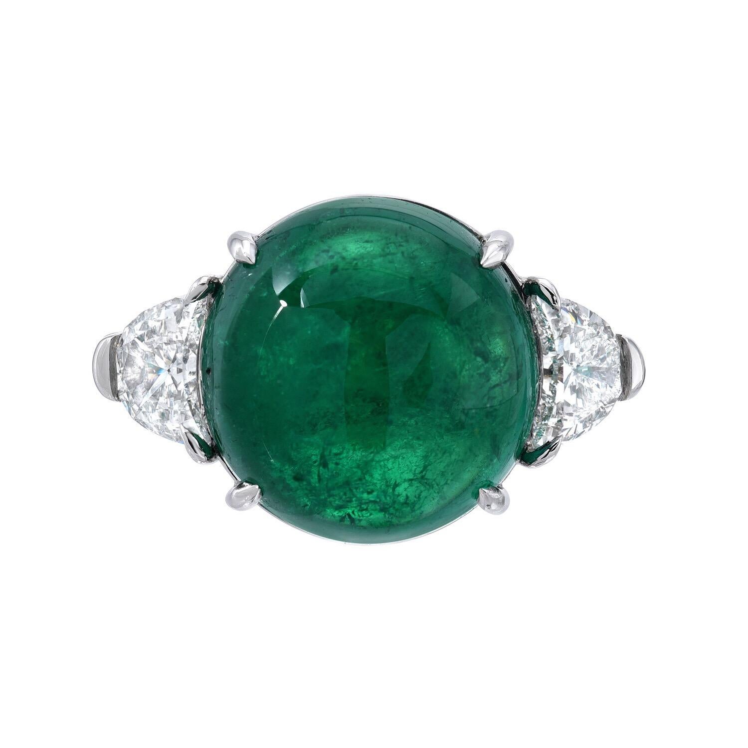 Colombian Emerald cabochon weighing a total of 7.67 carats and a total of 0.73 carats crescent shaped diamonds, E/VS, are set in this spectacular three stone platinum ring.
Size 6. Re-sizing is complimentary upon request.
Signed Merkaba.