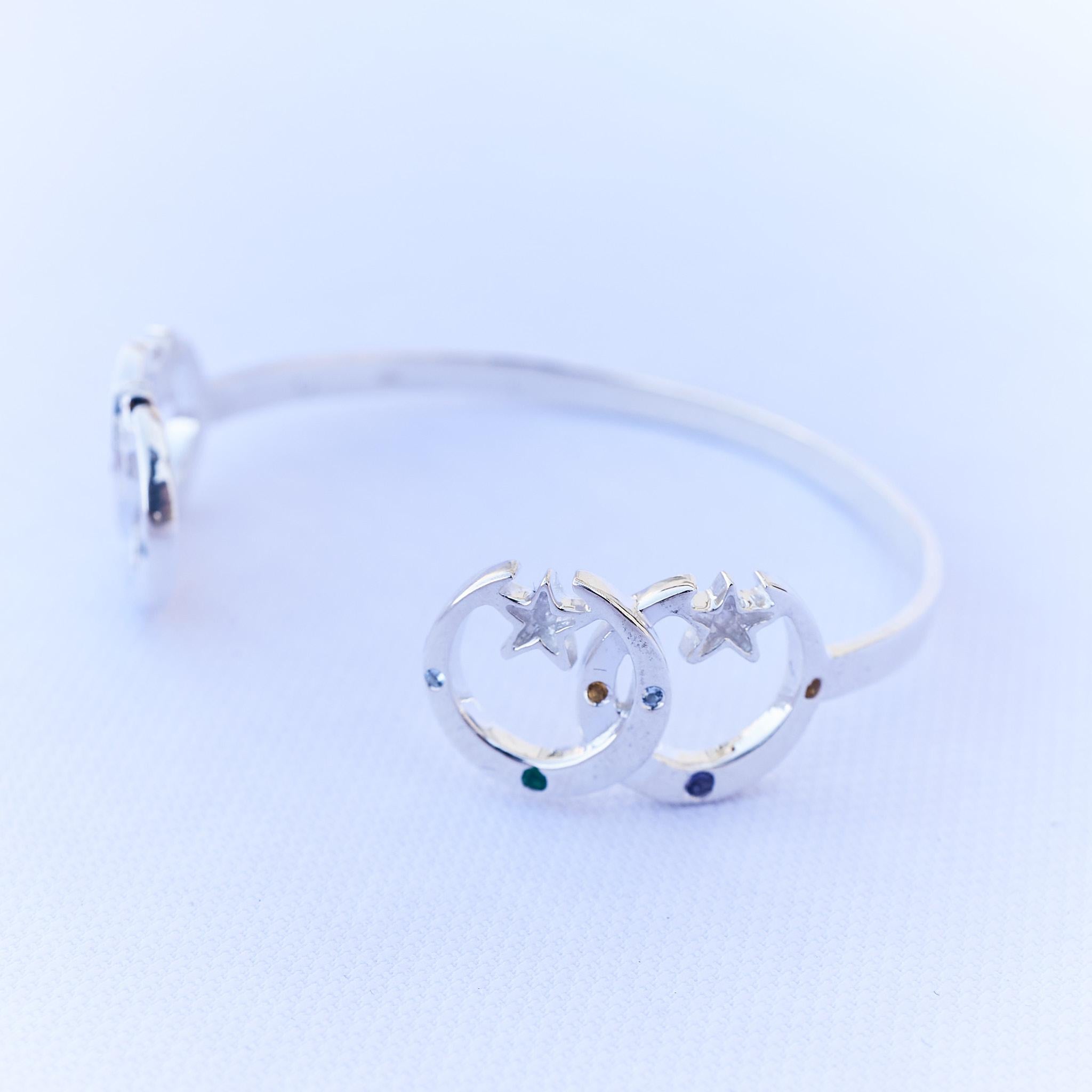 Emerald Aquamarine Iolite Orange Sapphire Crescent Moon Bangle Bracelet Silver 
Designer: J Dauphin
J DAUPHIN 

Inspiration:
This bracelet symbolize the power of the moon and stars in our life symbolizing the eternal universe and our souls purpose.