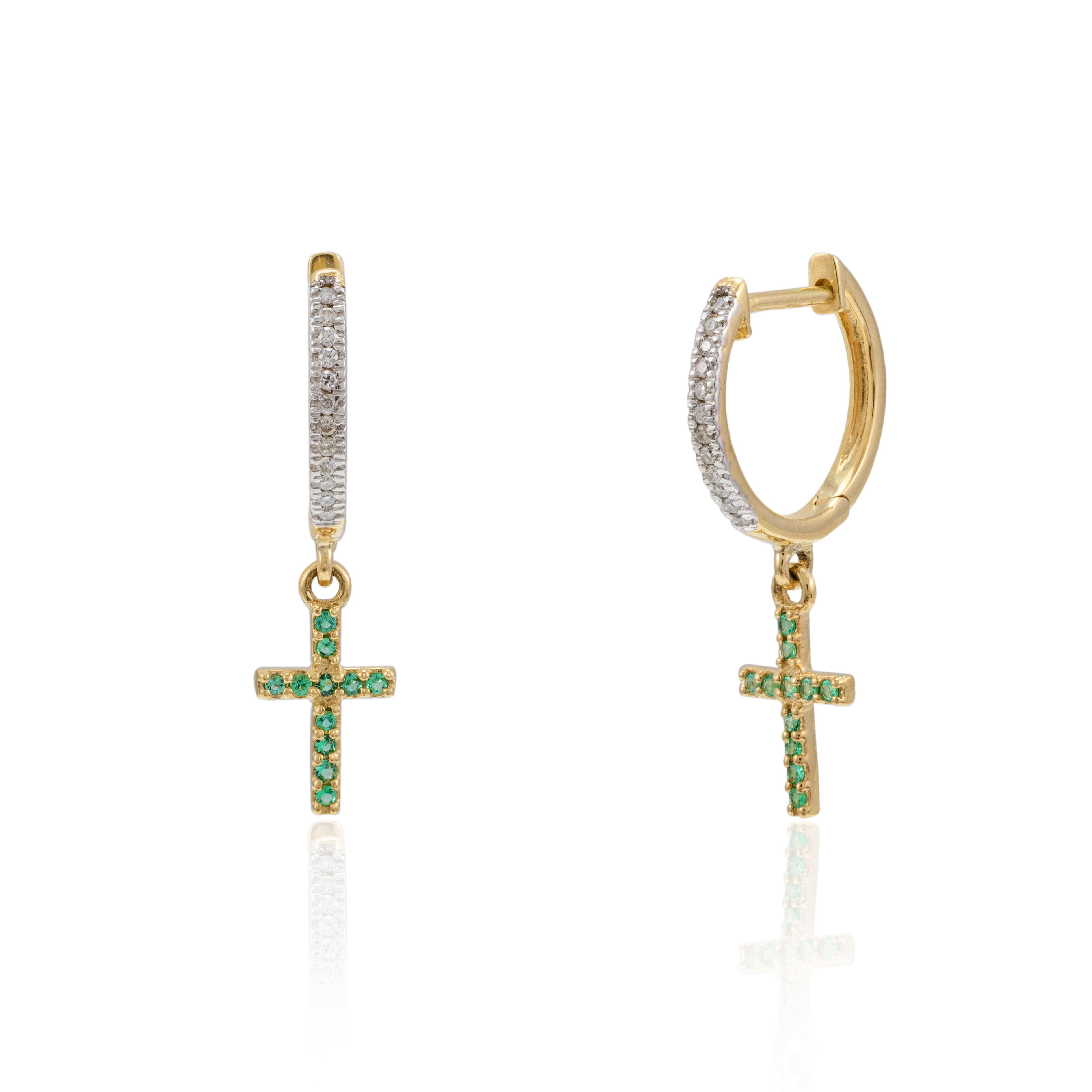 Natural Emerald Cross Dangle Hoop Earrings with Diamonds in 18K Gold to make a statement with your look. You shall need stud earrings to make a statement with your look. These earrings create a sparkling, luxurious look featuring round cut