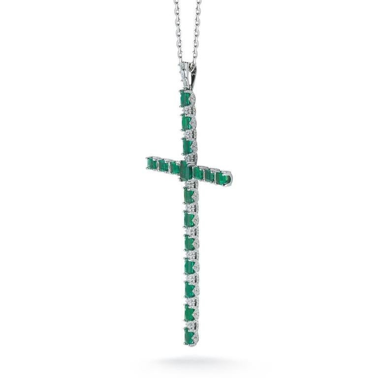 EMERALD CROSS PENDANT This 18k white gold emerald cross pendant is a modern look on the classic cross symbol. Octagon cut emeralds are prong set to give this pendant an elegant appeal Item: # 01898 Metal: 18k W Lab: C.dunaigre Color Weight: 14.67