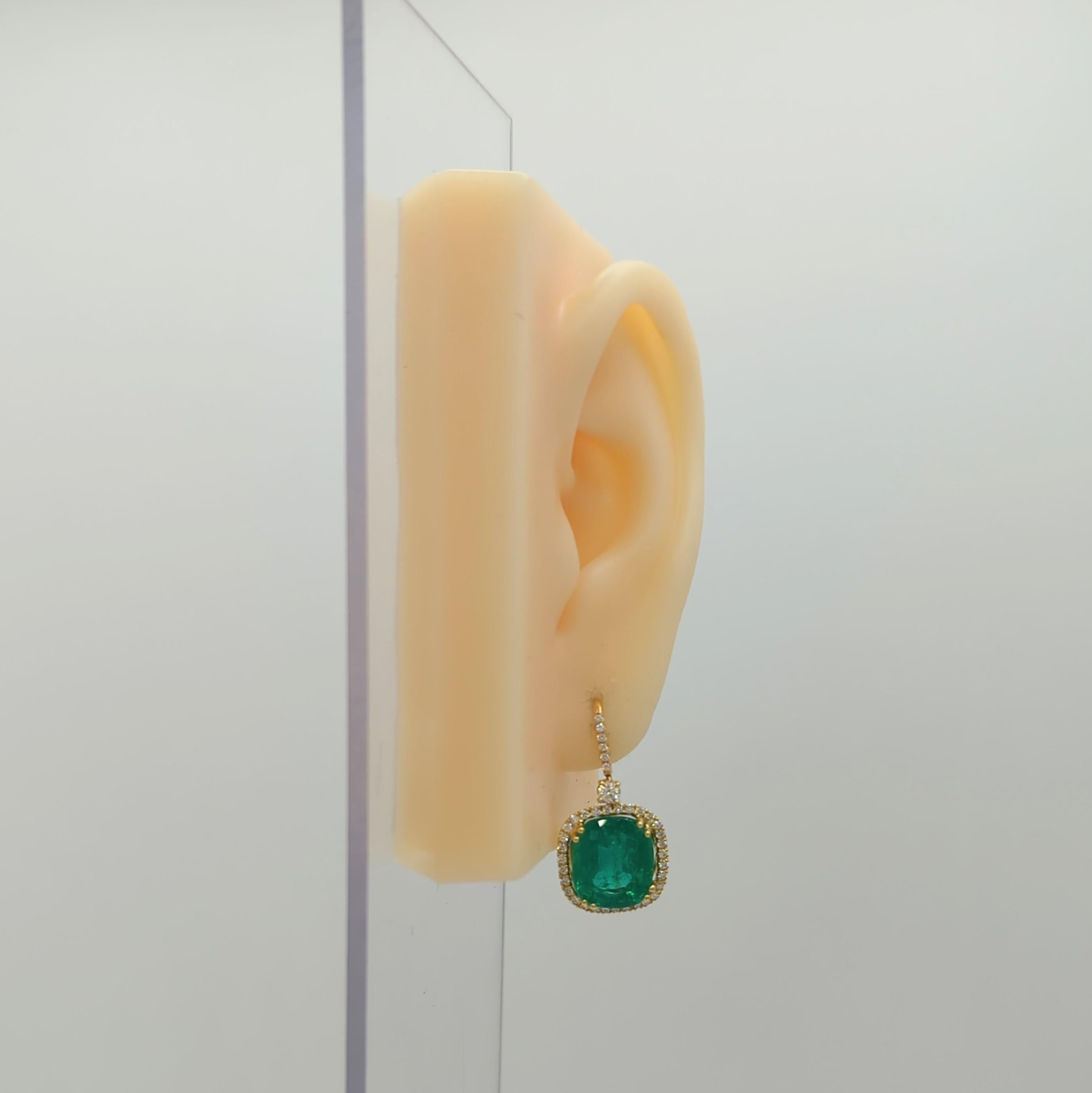Gorgeous 13.75 ct. emerald cushions with 0.50 ct. good quality white diamond rounds.  Handmade in 18k yellow gold.  These earrings are simple, classy, and a great addition to any fine jewelry collection!
